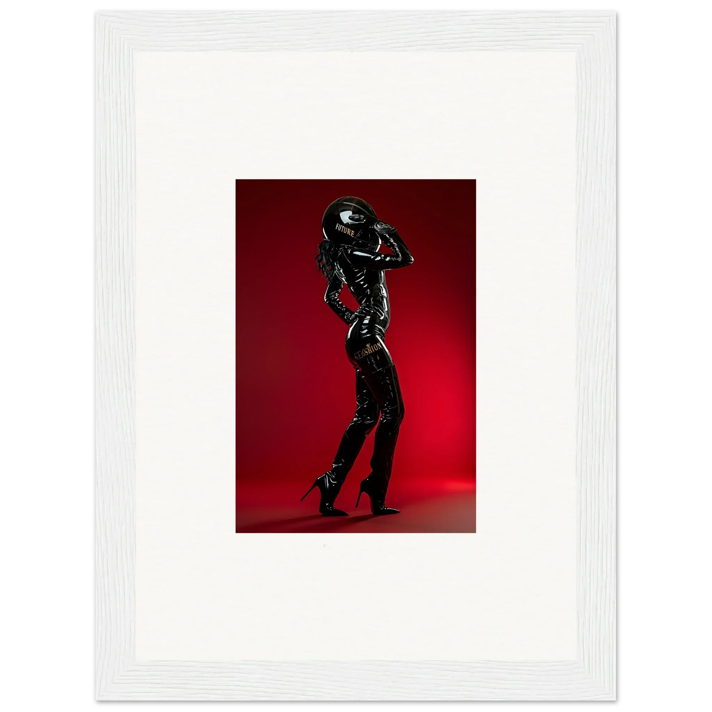 Silhouette of a person in a shiny black outfit striking a dance pose against a red background.