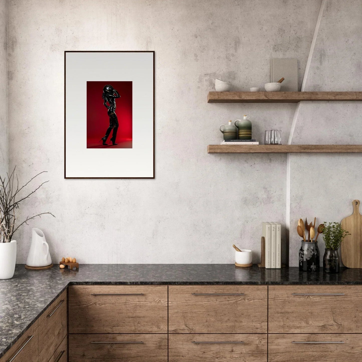 Modern kitchen with wooden cabinetry, open shelving, and a framed artwork featuring a silhouette against a red background.