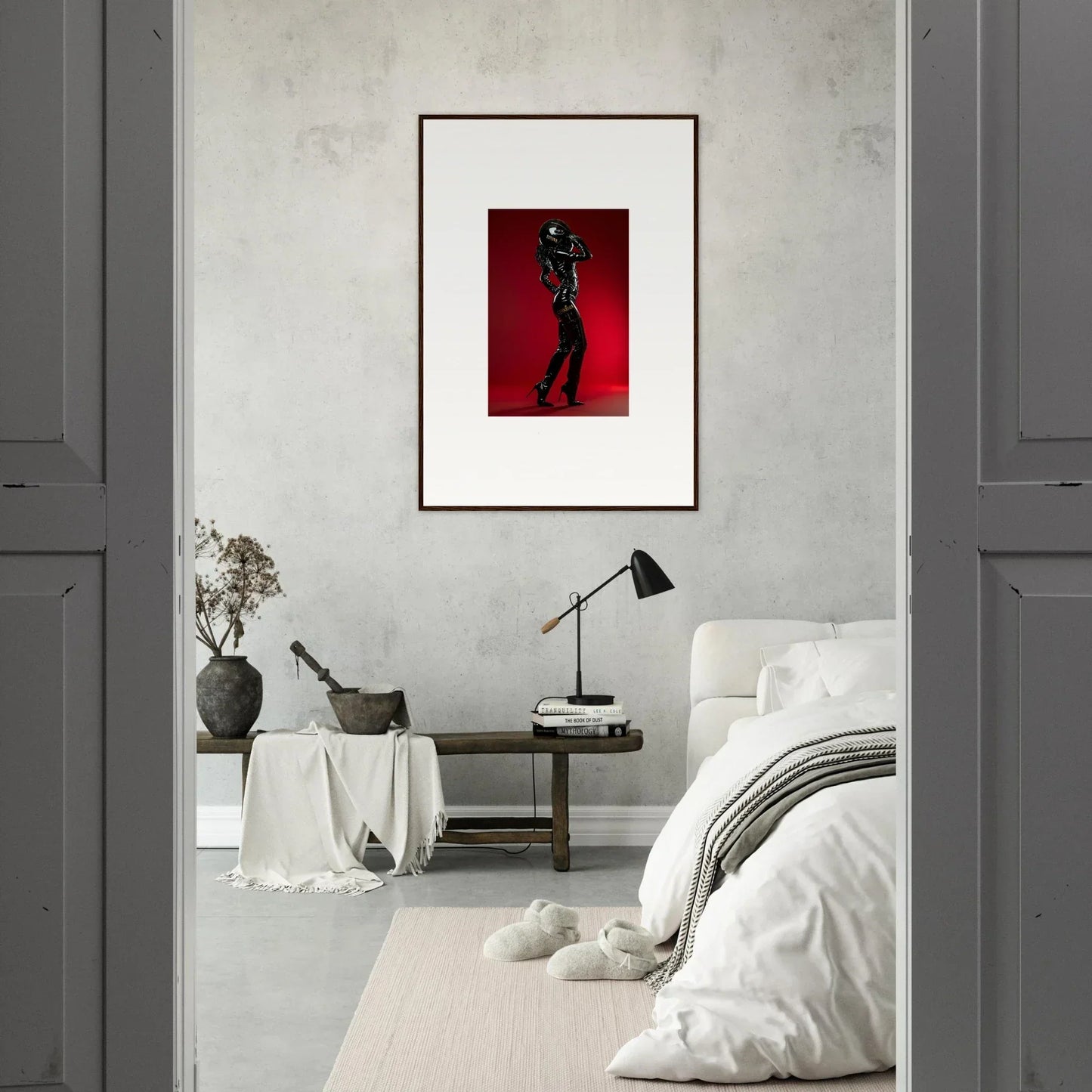 Framed photograph of a person posing against a red background.