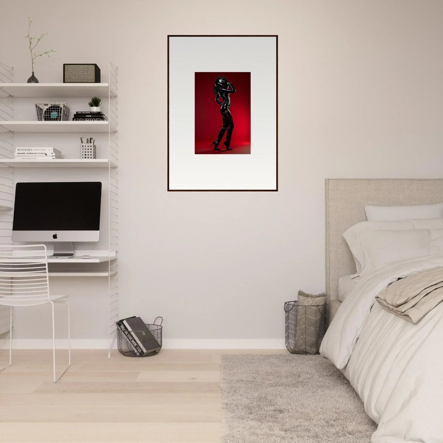Framed artwork featuring a silhouetted figure against a red background.