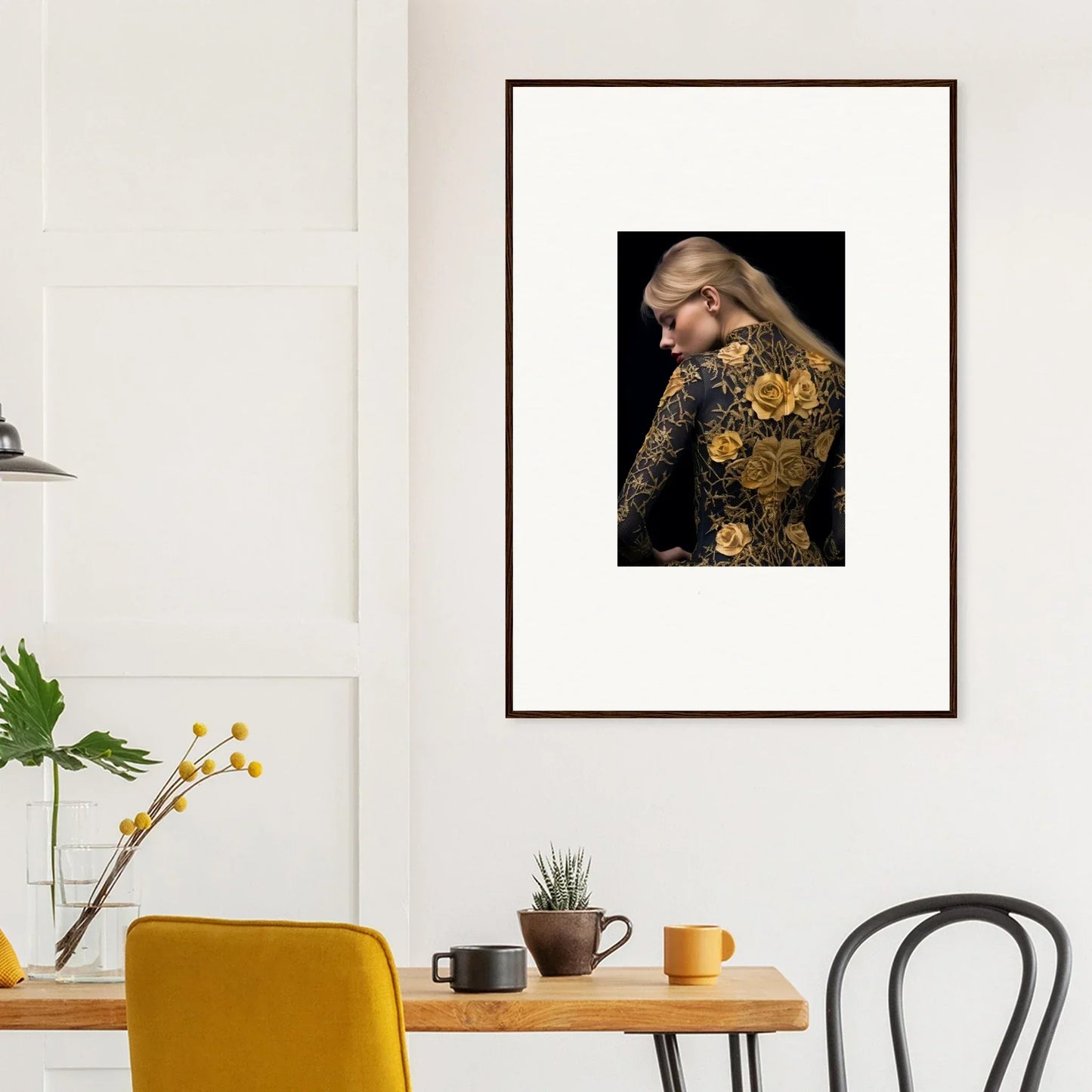 Framed portrait of a woman with long blonde hair wearing a dark outfit adorned with golden floral patterns.
