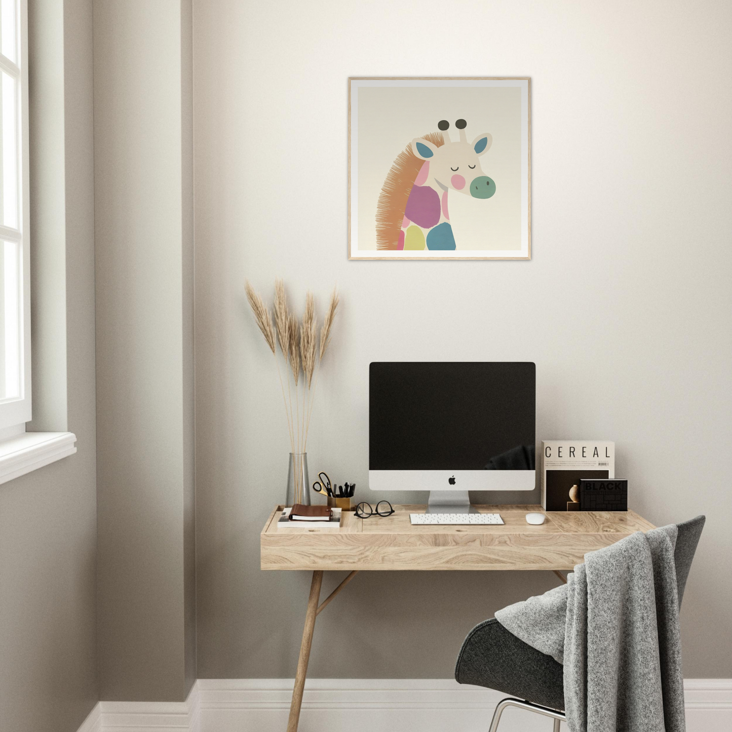 Minimalist wooden desk with iMac computer and Giraffe Tranquil Triptych artwork above