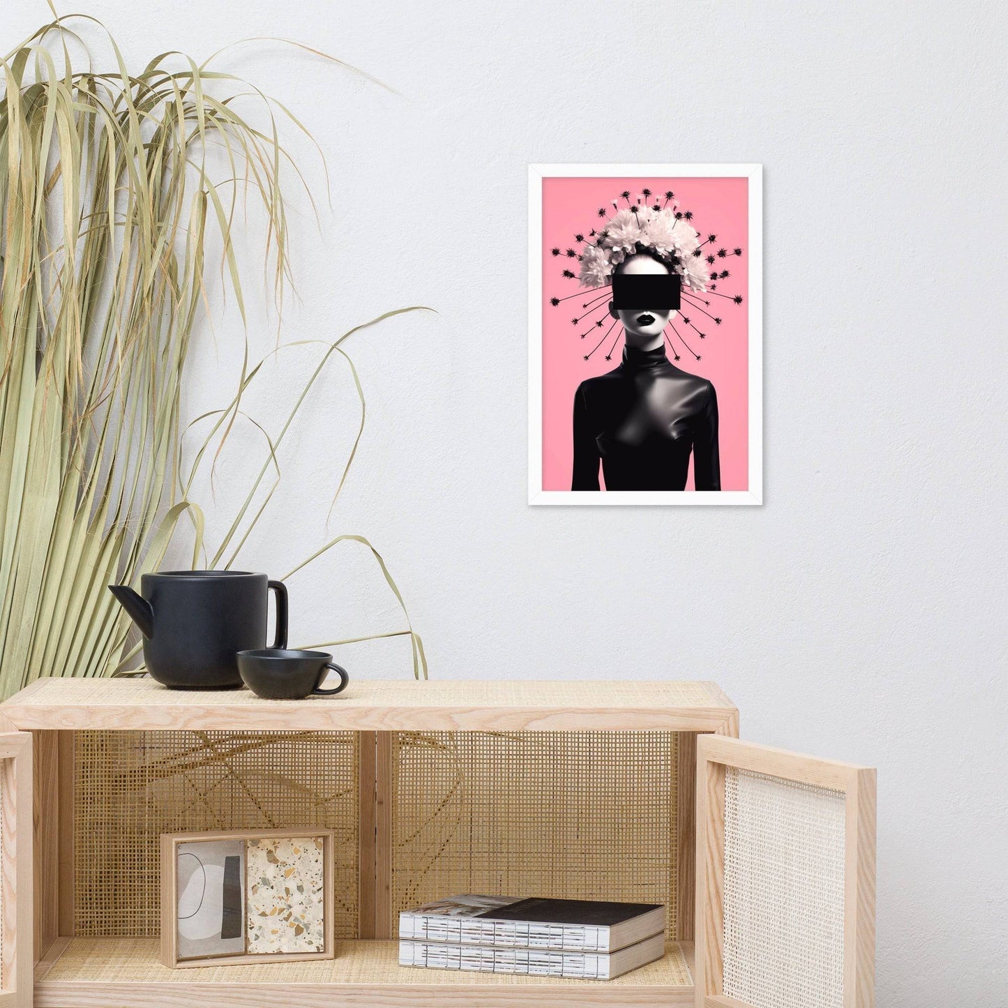 Artistic print featuring a silhouetted figure with a geometric pattern radiating from the head against a pink background.