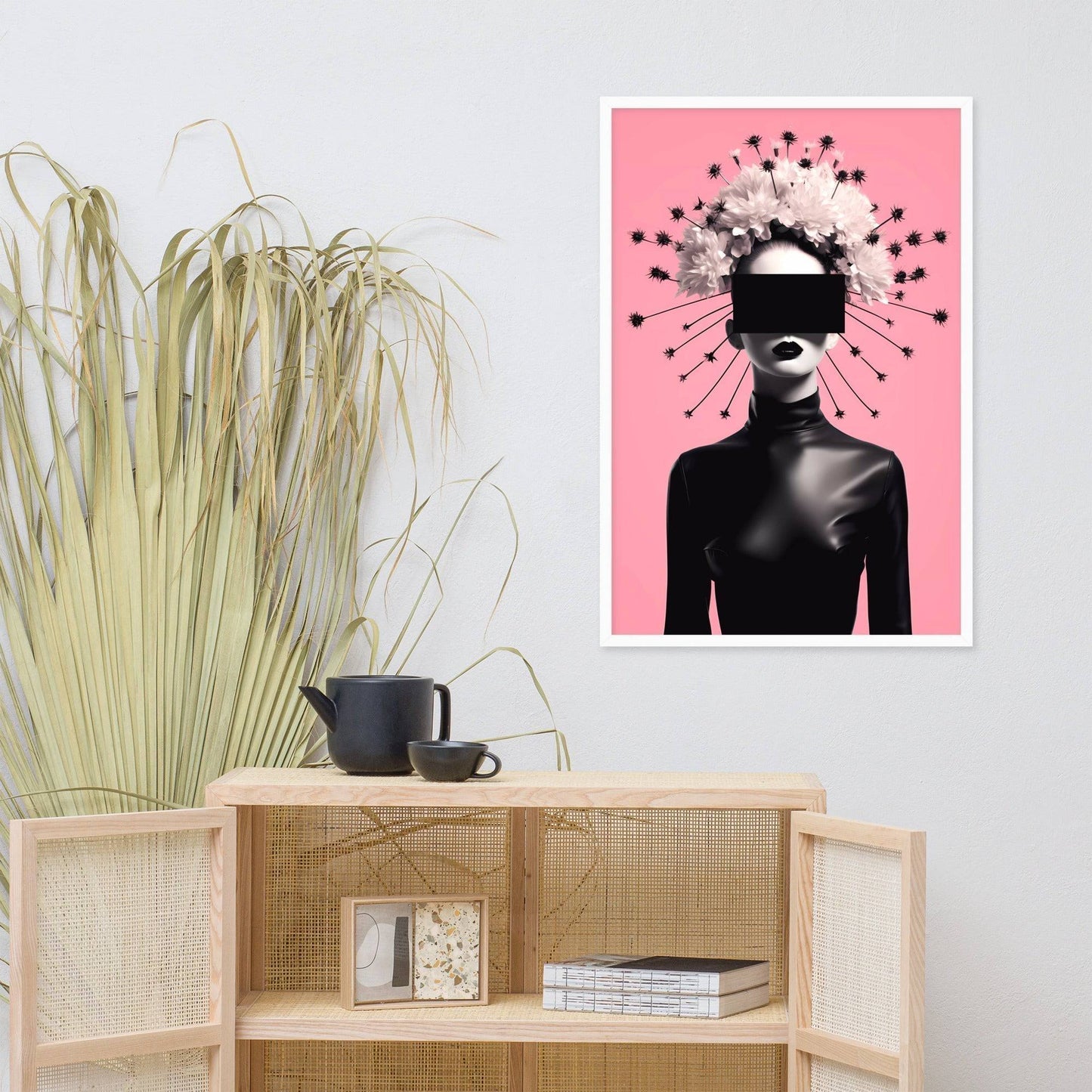 Artistic print featuring a stylized figure with a radiant halo-like headdress against a pink background.