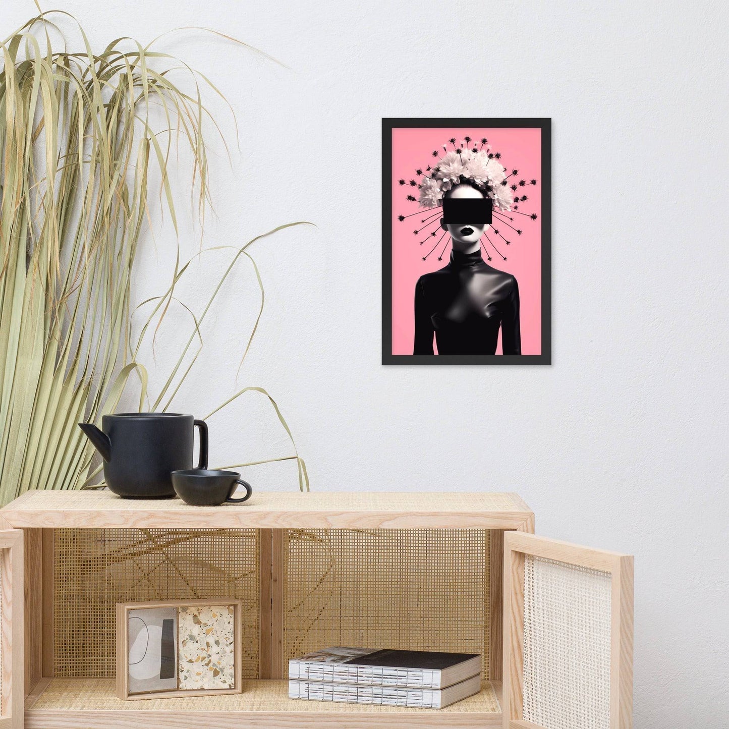 Framed artwork featuring a silhouetted figure with a burst of stars around their head against a pink background.