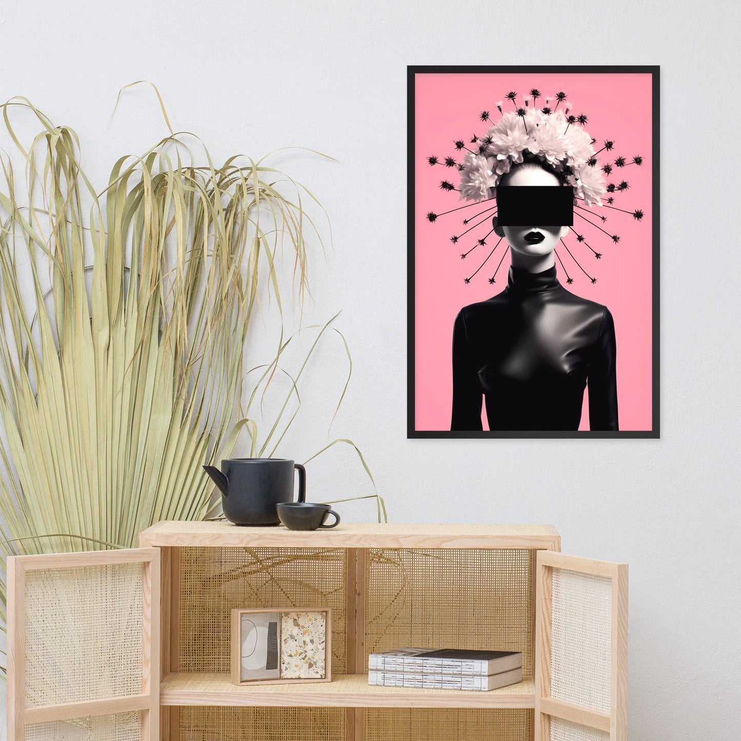 Framed artwork featuring a stylized silhouette with a radiant halo-like design against a pink background.