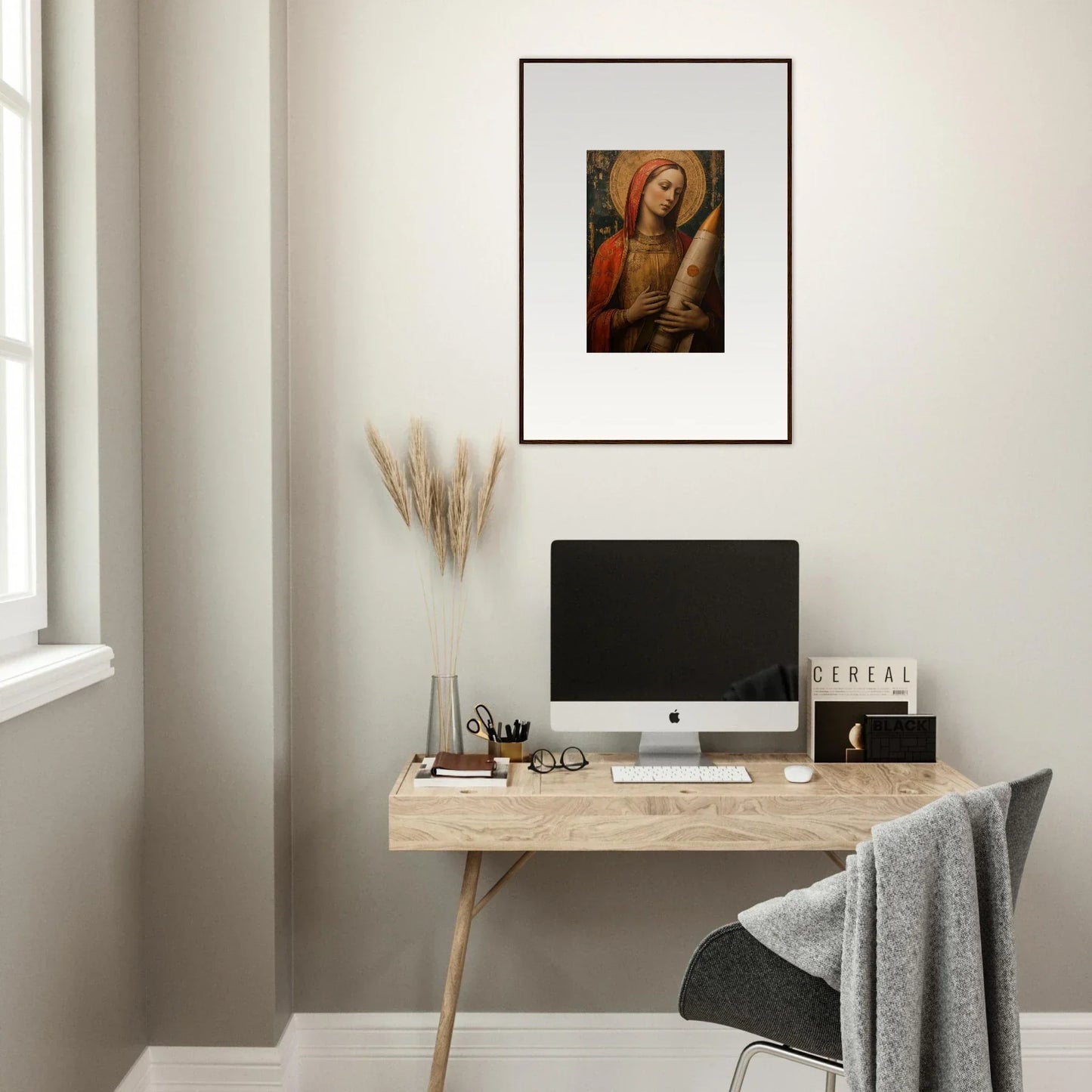 Minimalist home office with wooden desk, computer, and Celestial Cargo canvas print