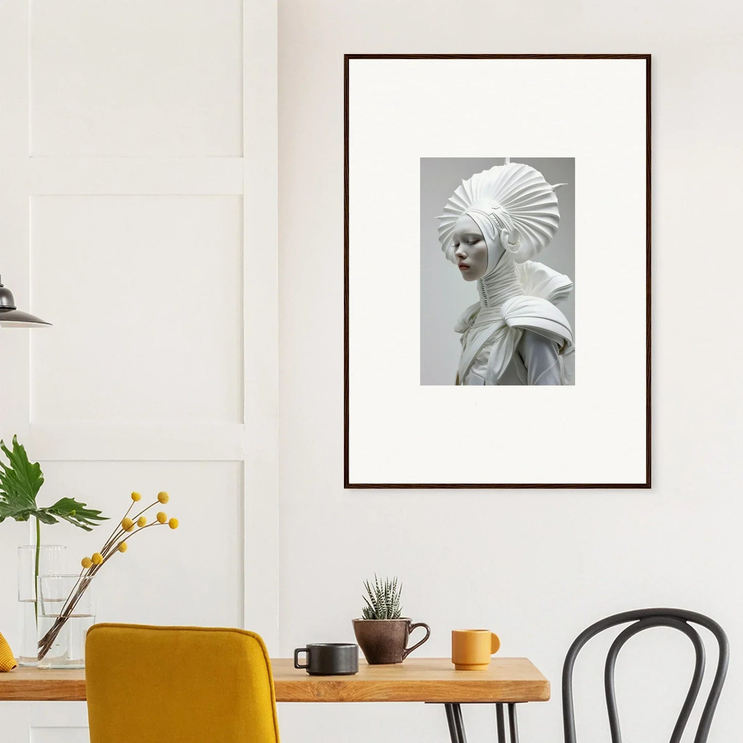 Framed wall art featuring a figure in an elaborate ivory halos headdress and collar