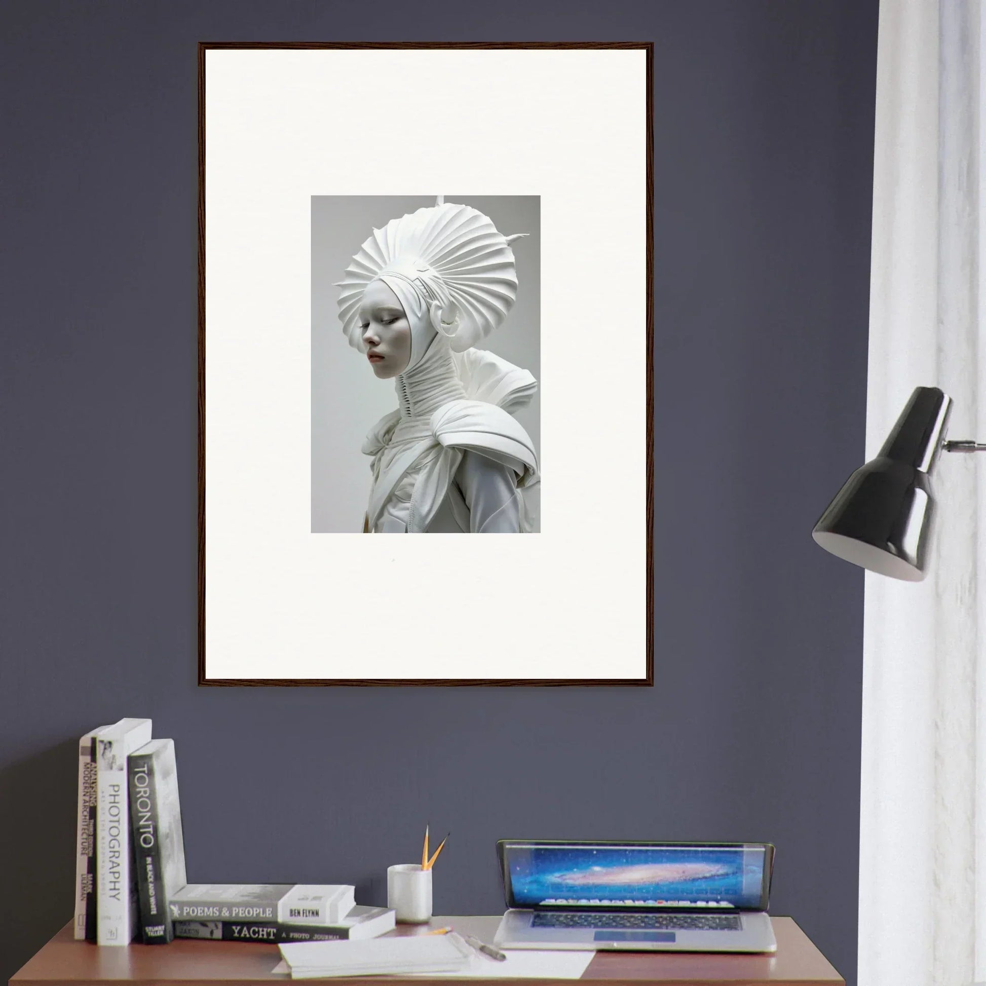 Framed black and white photograph of person in elaborate ivory halos costume for room decor