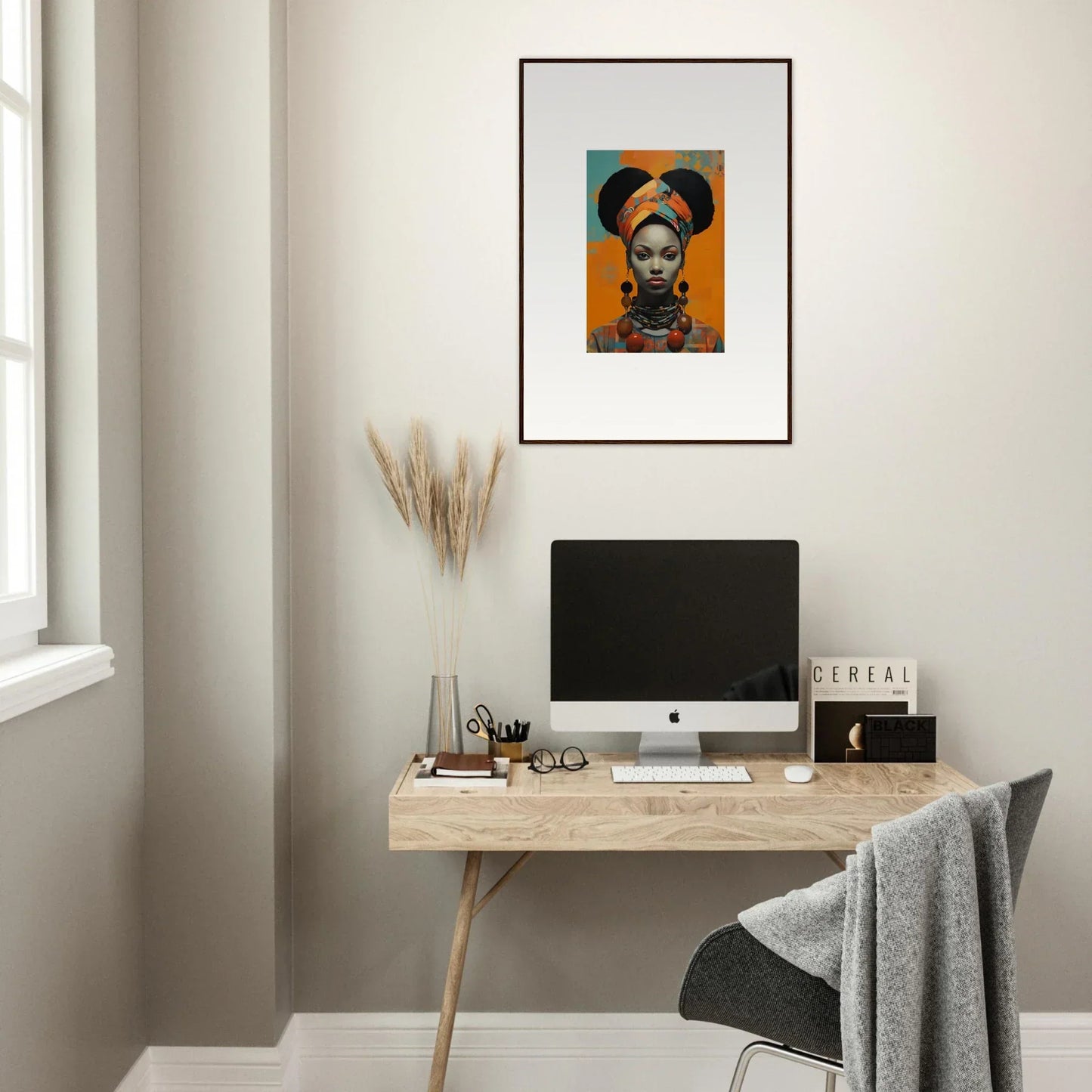 Minimalist home office with Hues Dreamkeeper Sagrado and framed wall art above the desk