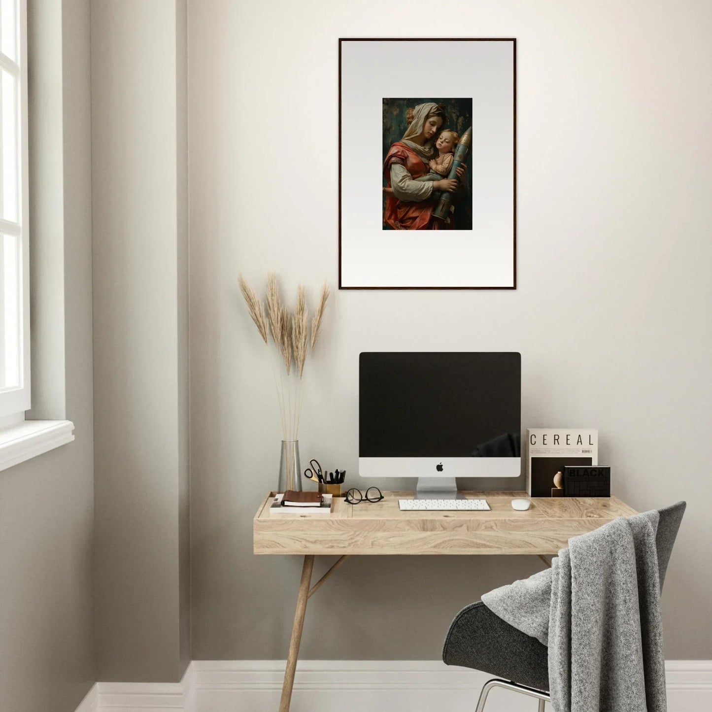 Minimalist wooden desk with computer monitor and framed wall art for Aedel Composure room decor