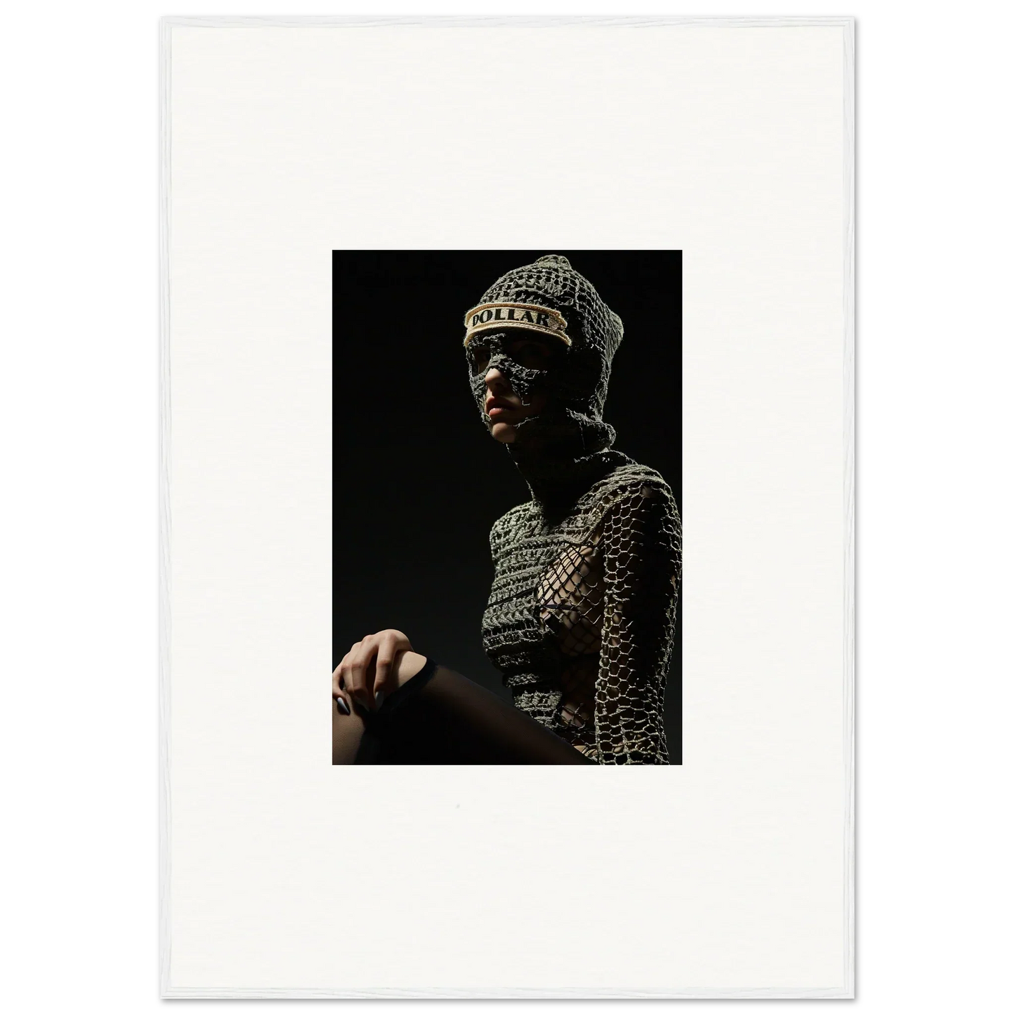 Ornate metallic headpiece and armor worn by a figure in dramatic lighting.