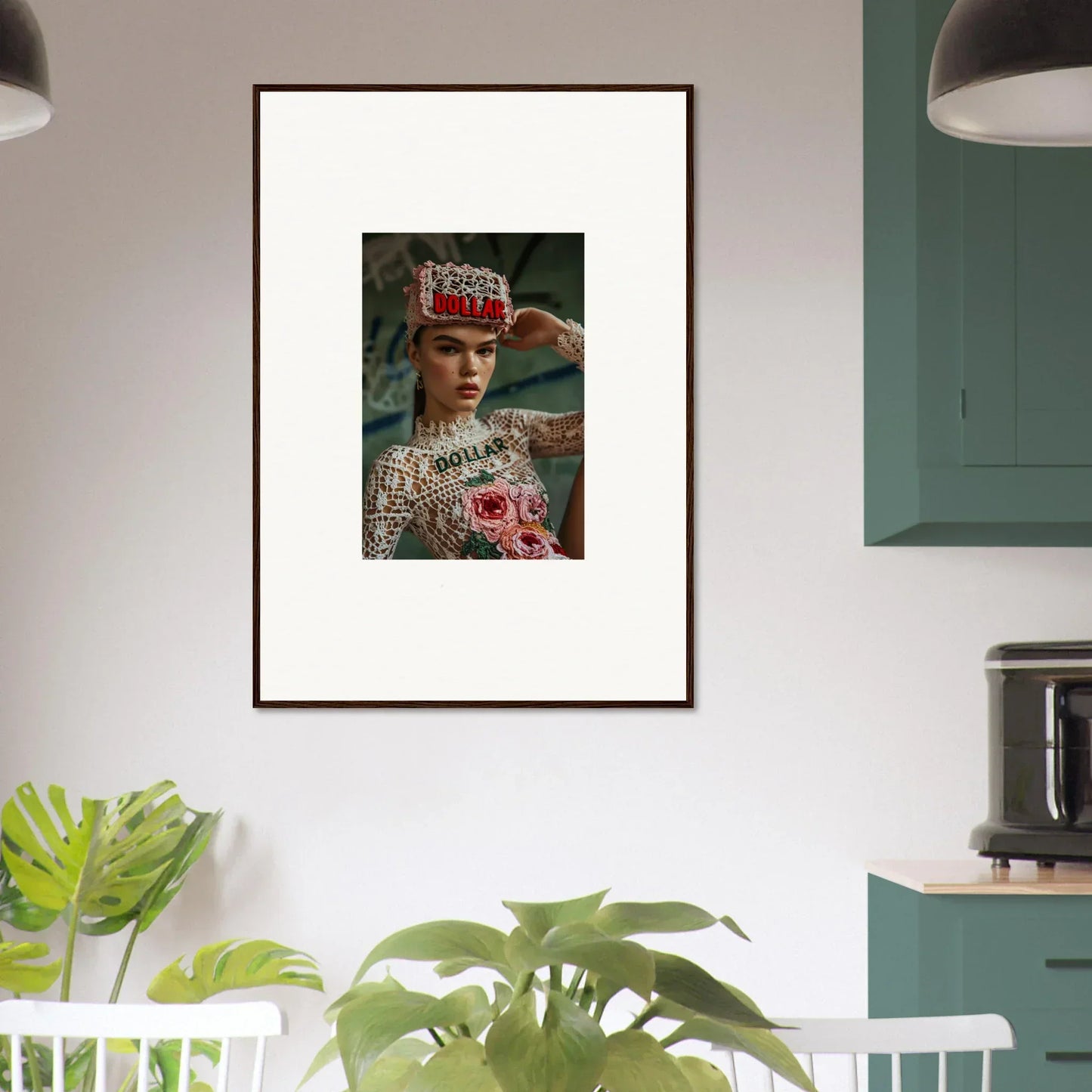 Framed wall art of a person in ornate headdress enhances Monet Bliss room decor