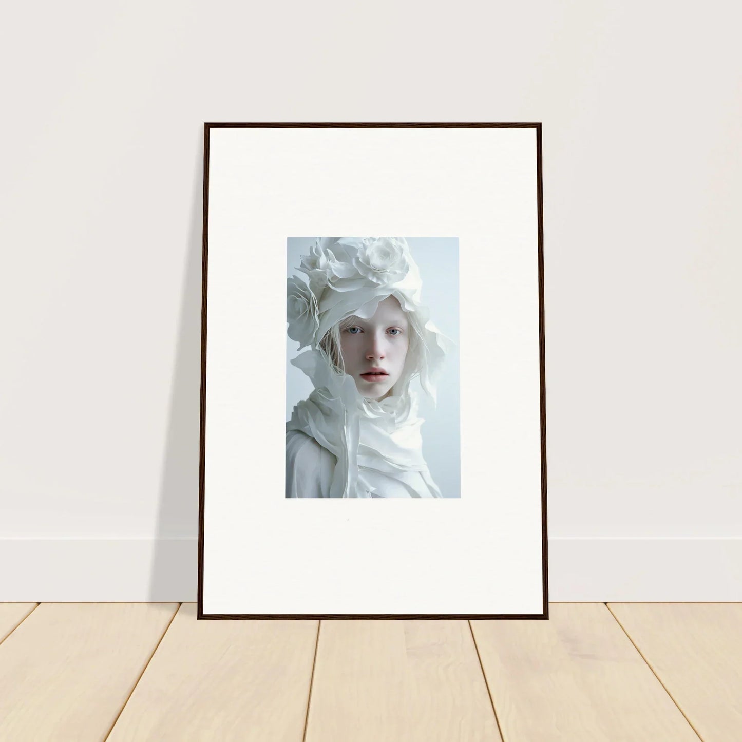 Framed portrait of a person with pale features, ideal for room decor or wall art