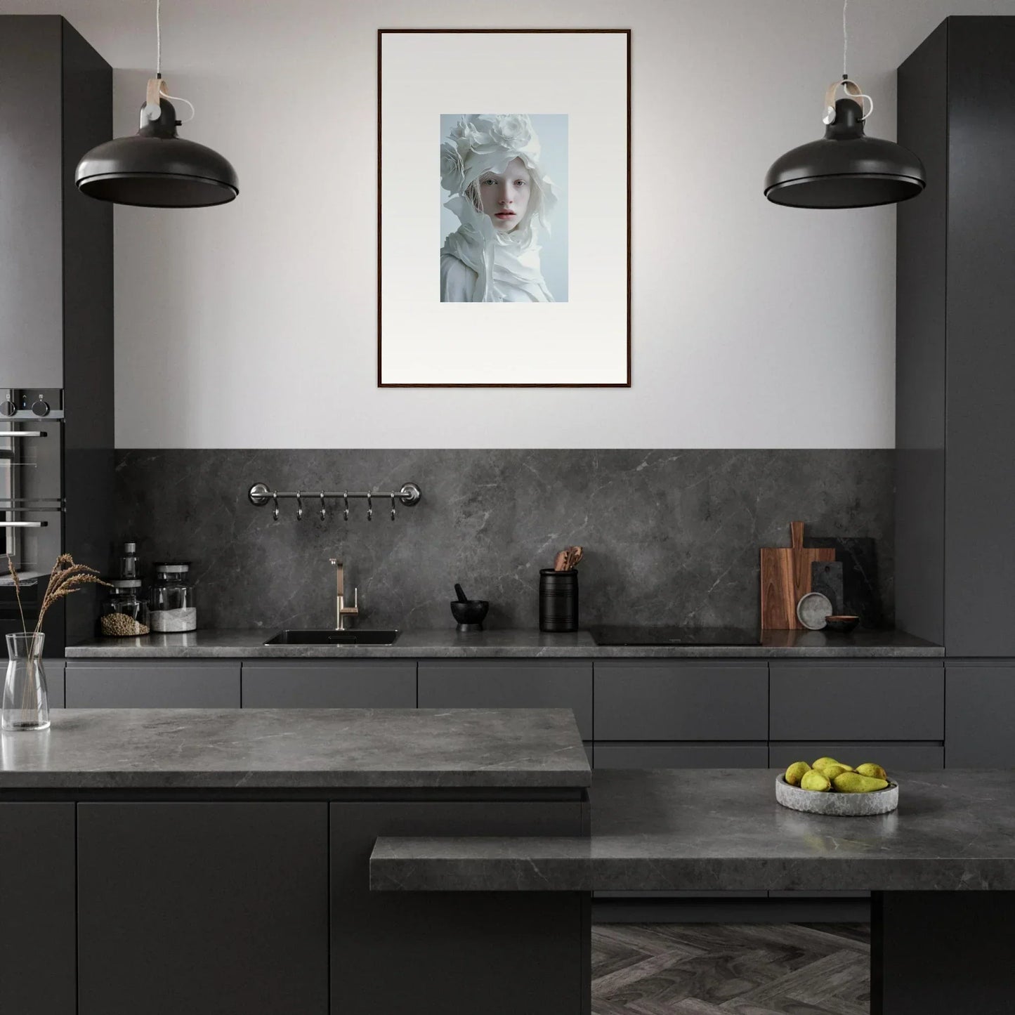 Modern kitchen featuring dark cabinetry, gray countertops, and stylish pendant lighting
