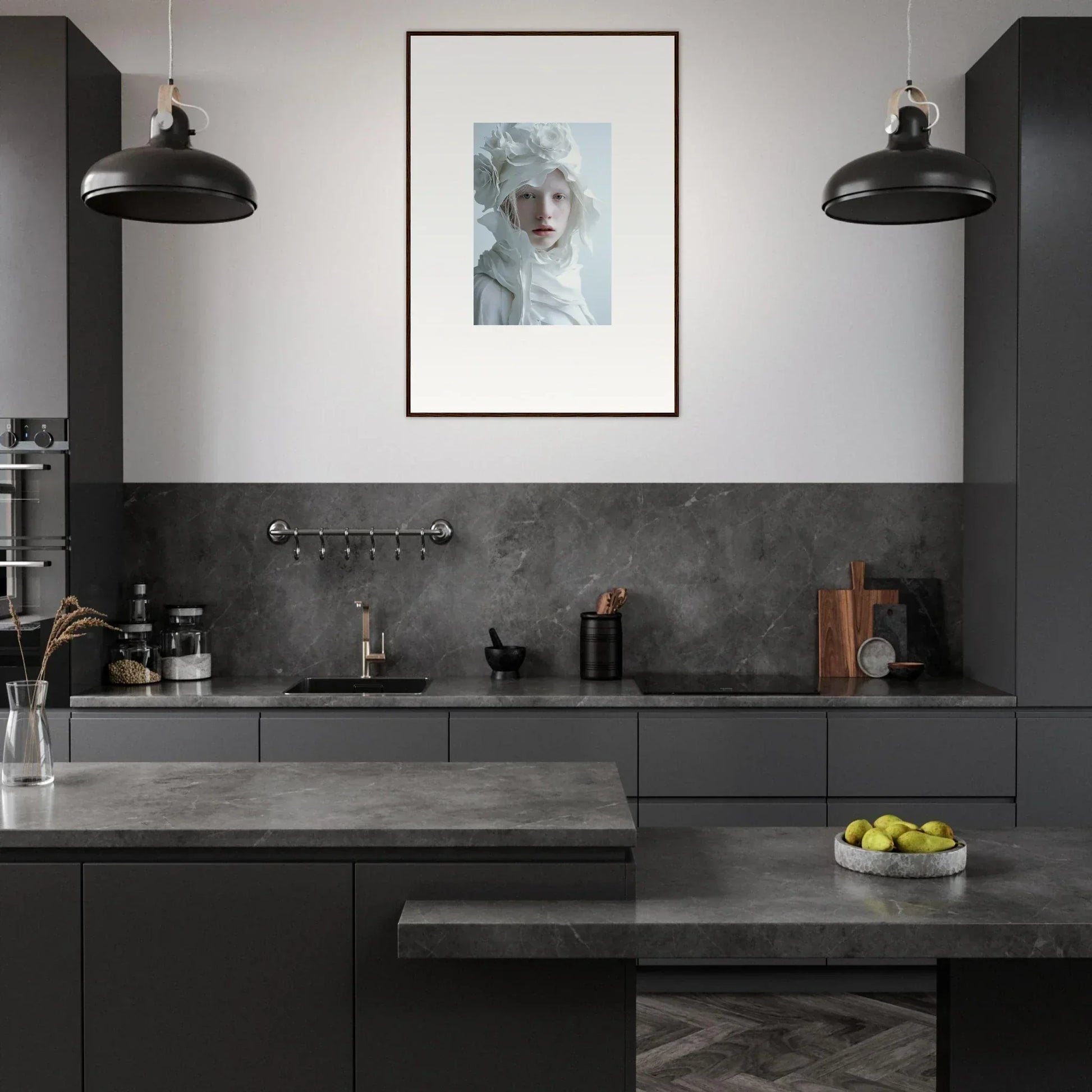 Modern kitchen featuring dark cabinetry, gray countertops, and stylish pendant lighting