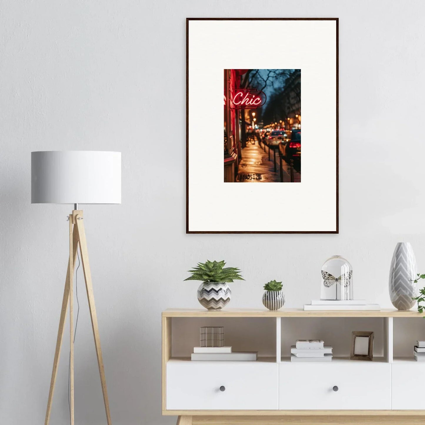 Framed wall art of a neon Chic sign on a city street for trendy room decoration