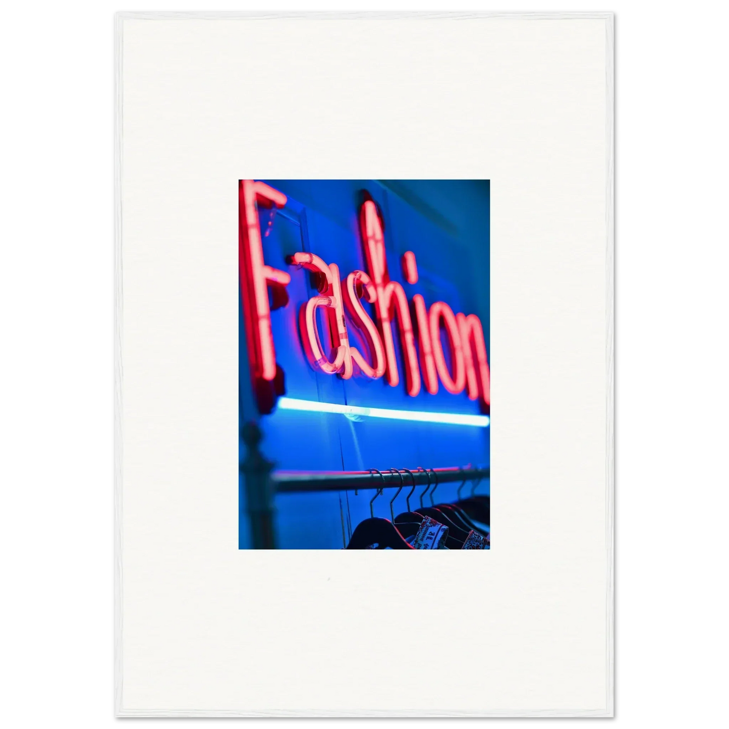 Neon sign saying Fashion in pink above a clothing rack, perfect room decoration