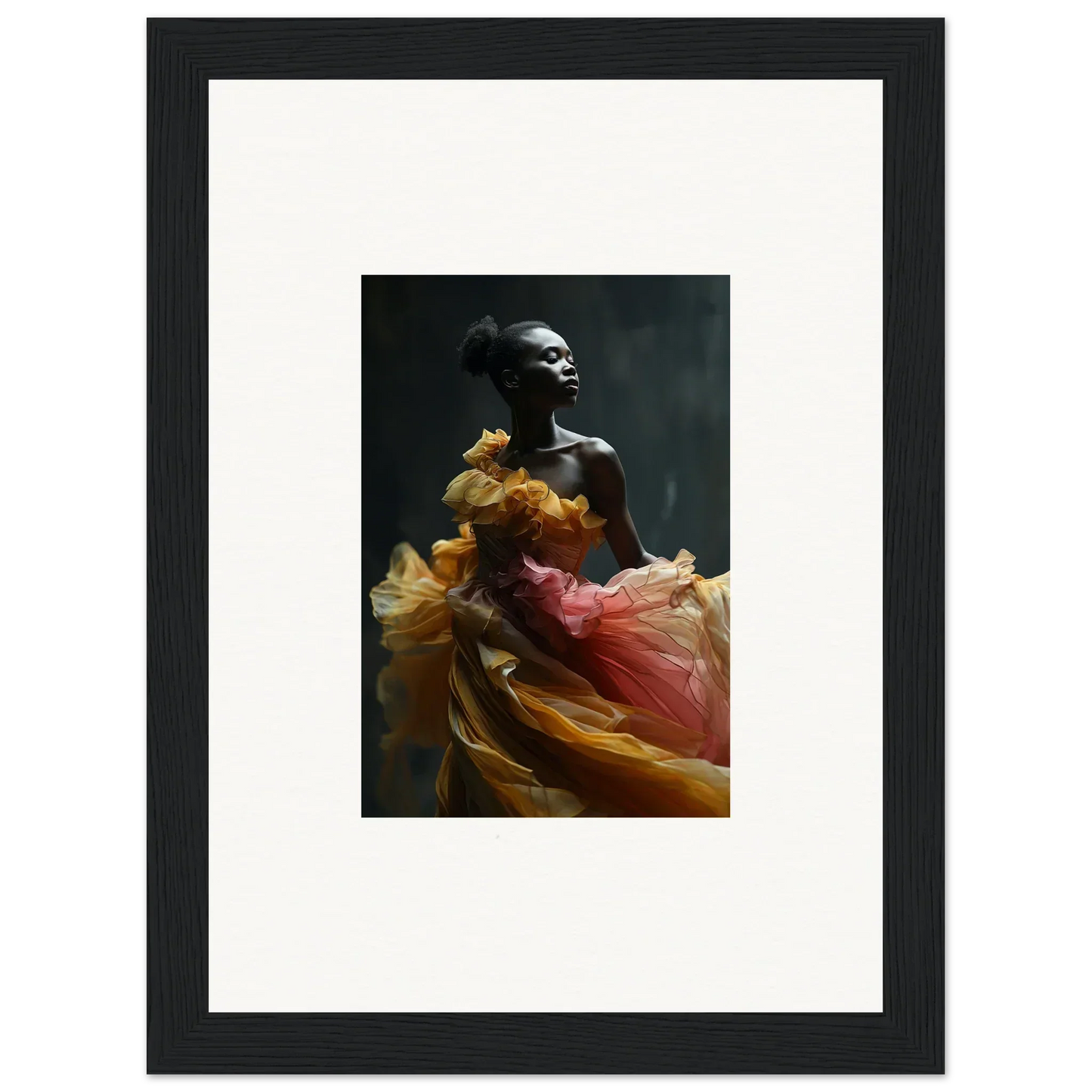 Framed photograph of a person draped in flowing, colorful fabric.