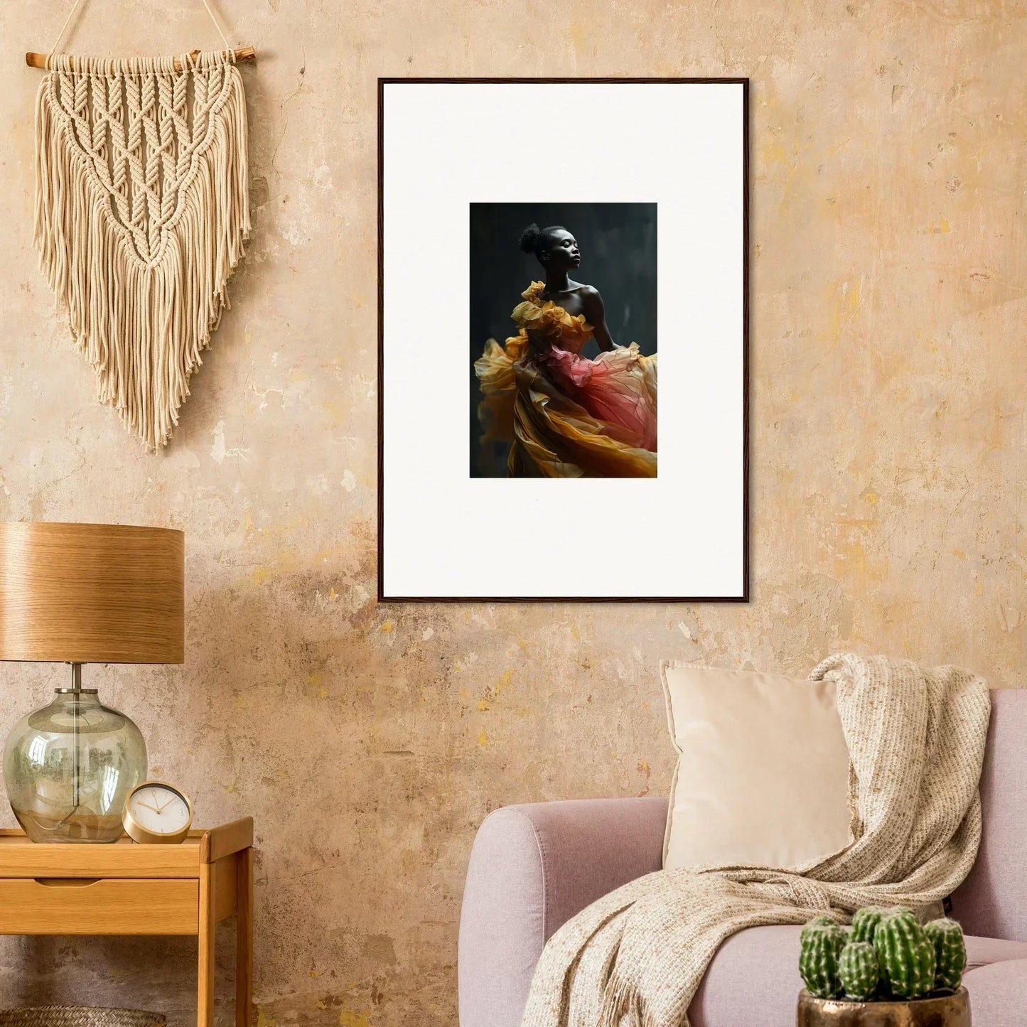 Framed artwork depicting a dark-skinned figure in colorful, flowing fabric.