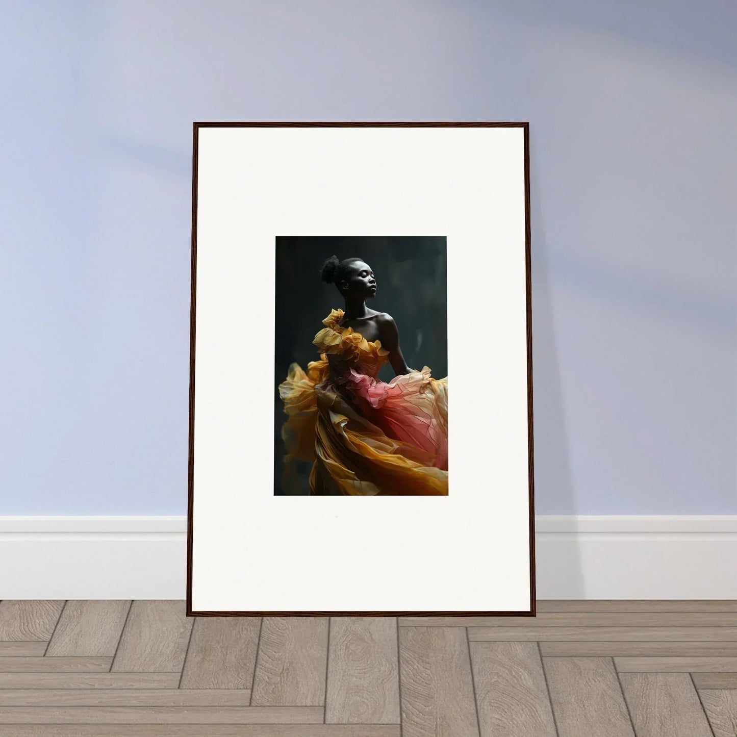 Framed artwork depicting a figure in colorful flowing fabric against a dark background.