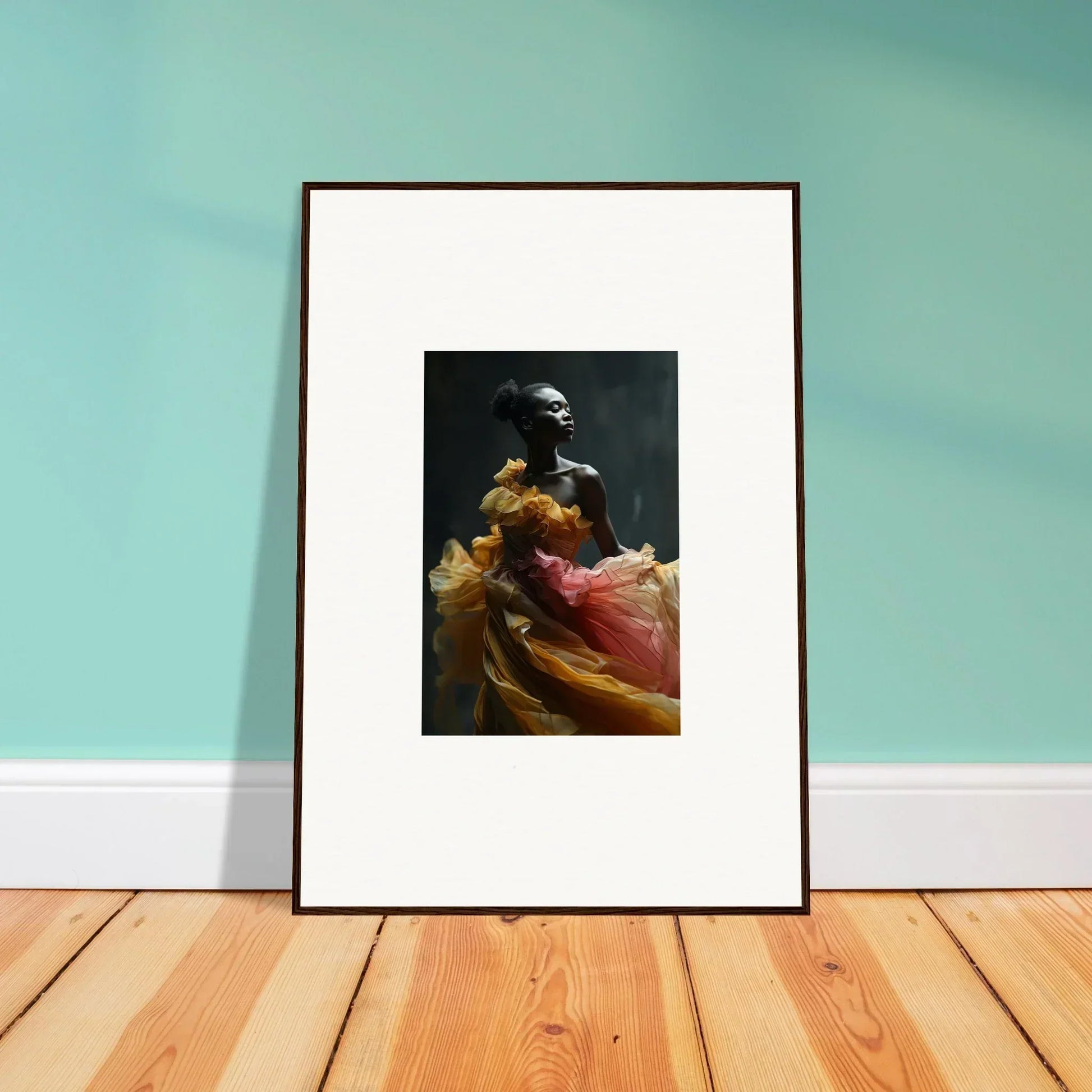 Framed artwork depicting a figure in colorful flowing fabric against a dark background.