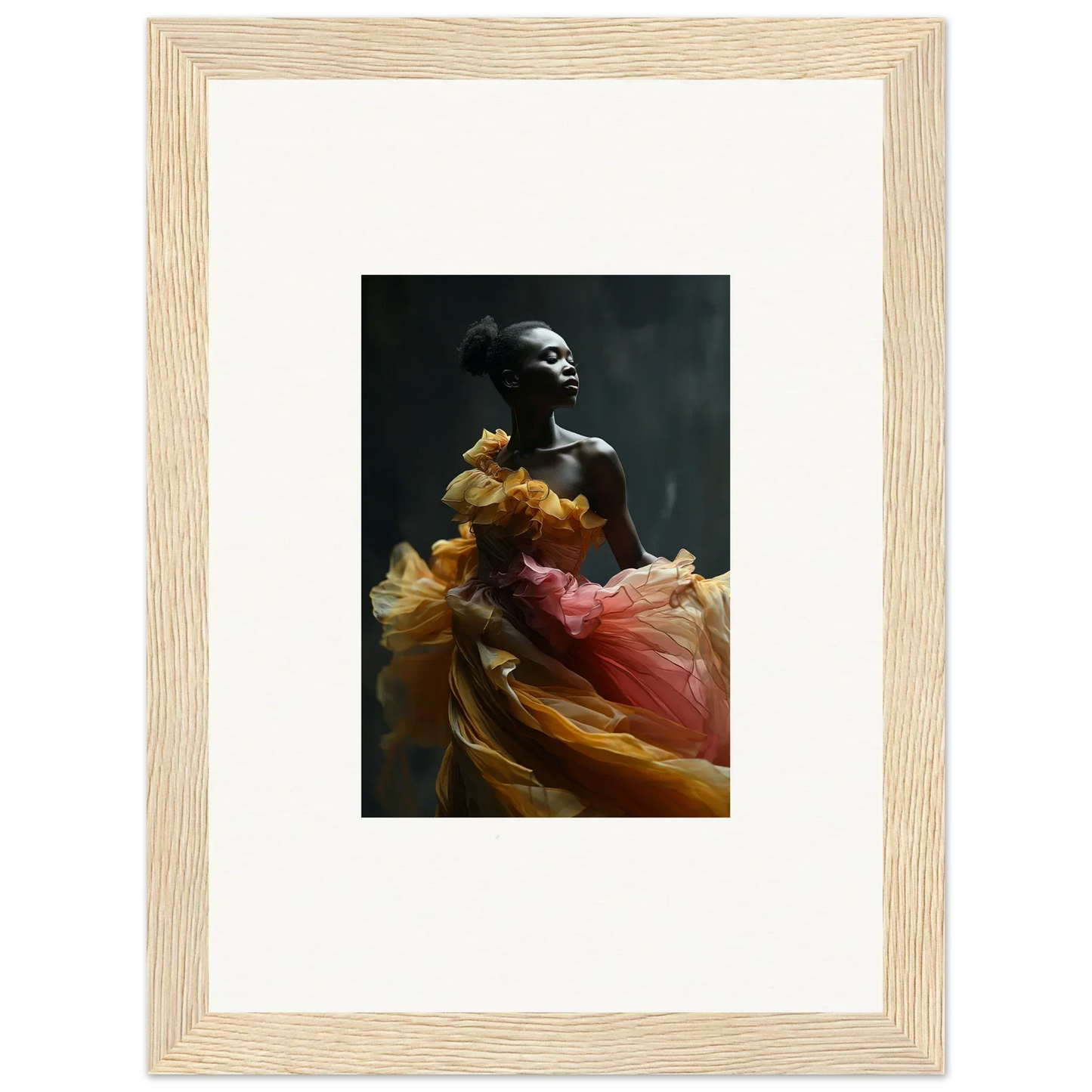 Framed black and white photograph of a person draped in flowing, colorful fabric.