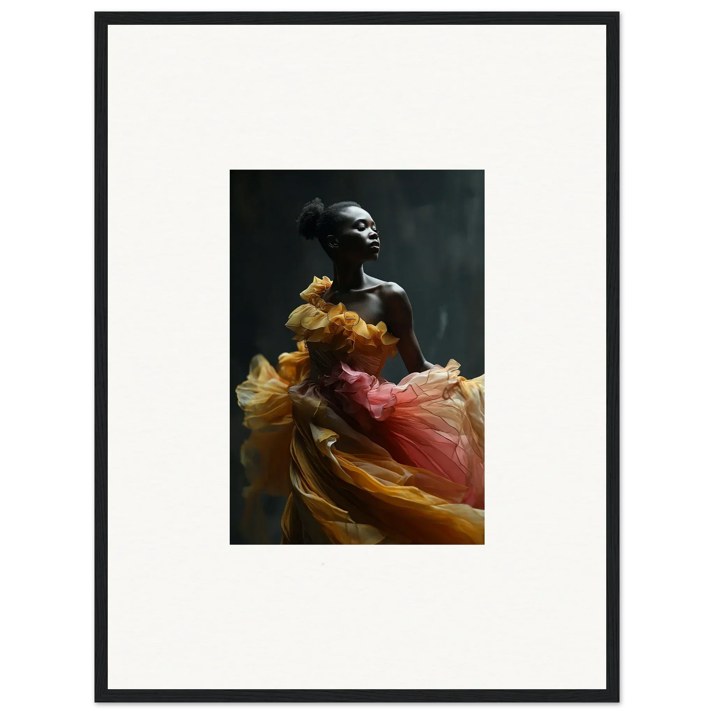 Photograph of a person draped in flowing, colorful fabric against a dark background.