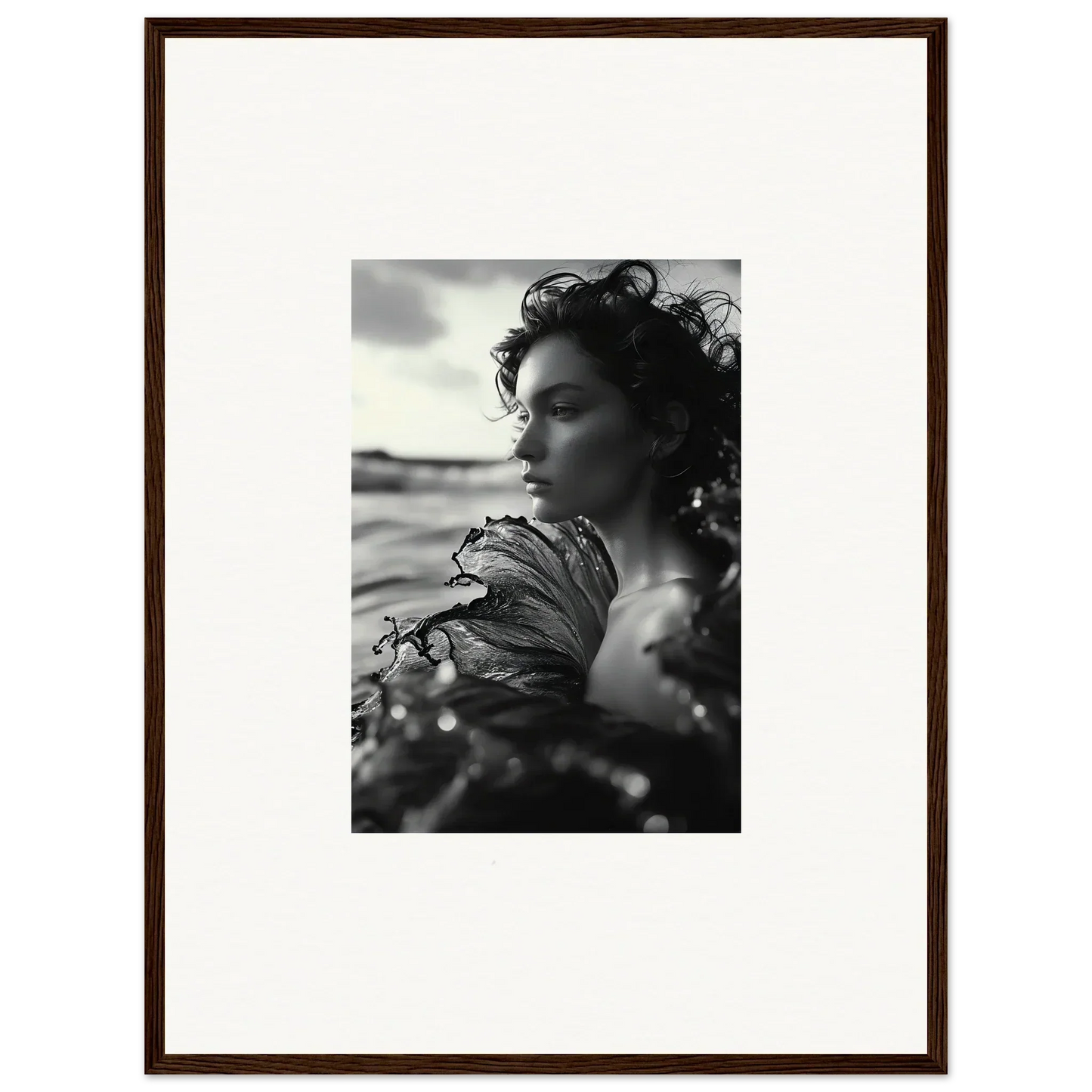 Black and white photo of a woman by the water, perfect for a Sea Reverie canvas print