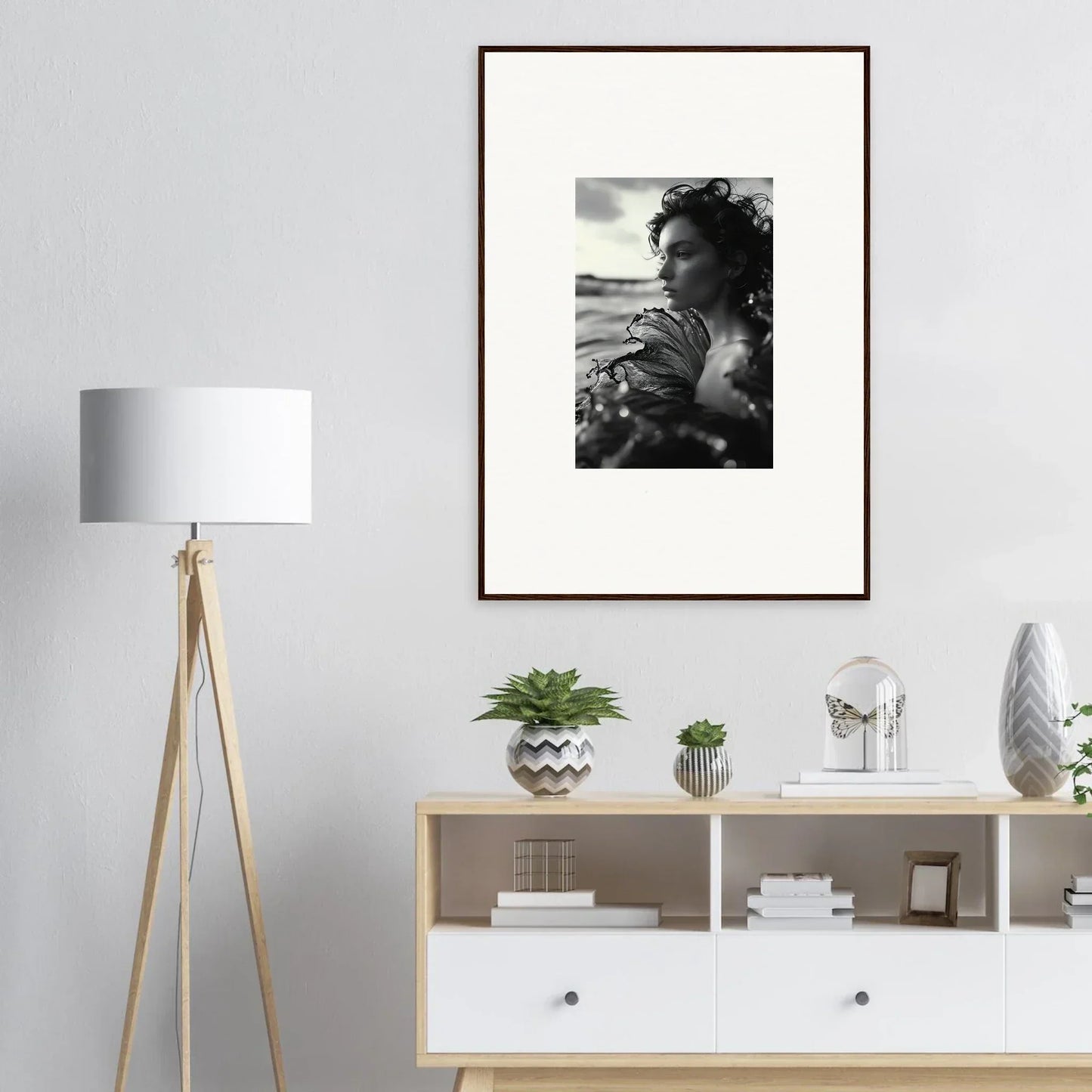 Framed black and white photo of a person in sea reverie, perfect for room decoration