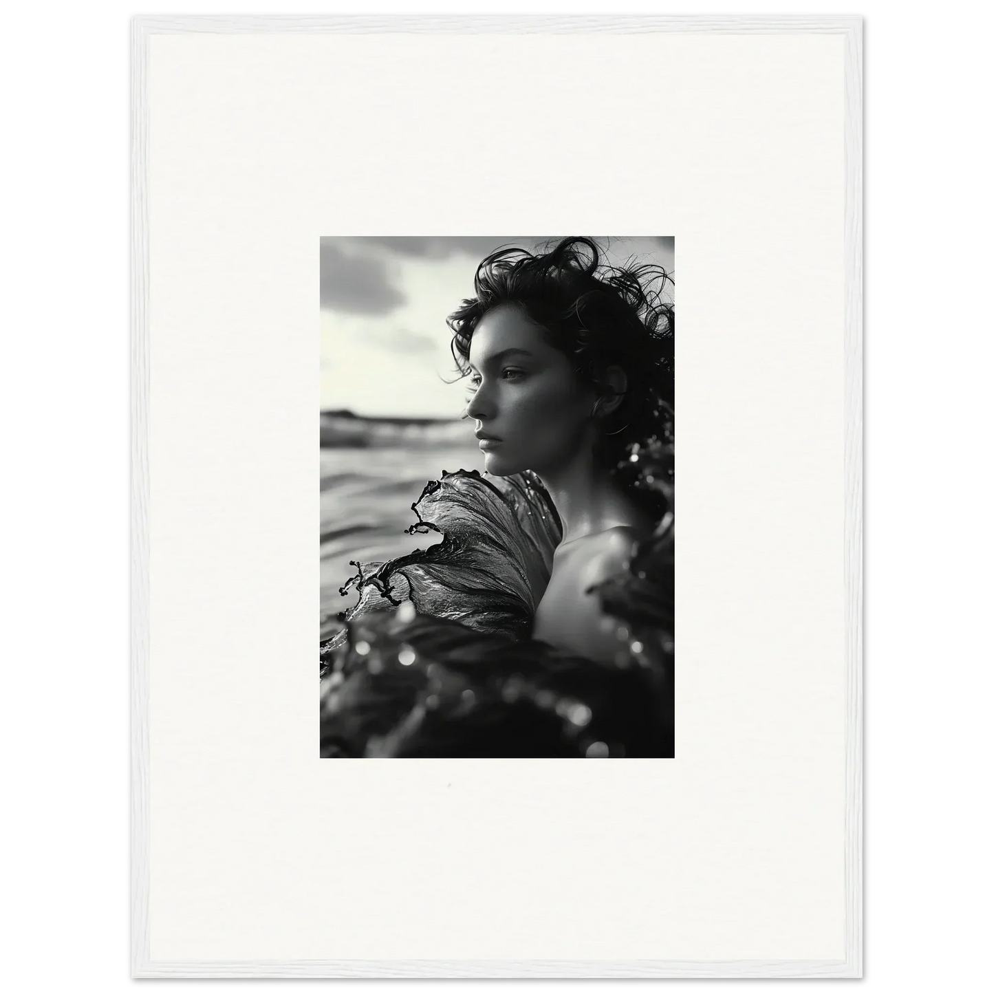 Black and white photo of a woman by the water, perfect for your Sea Reverie canvas print