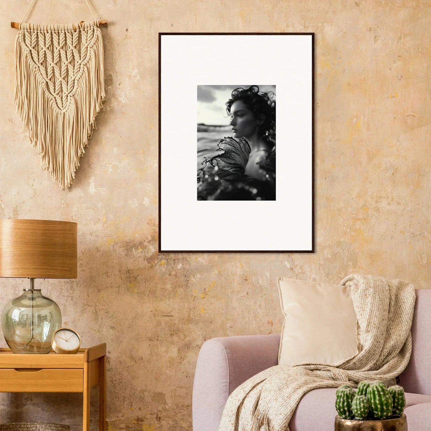 Framed black and white photo of a person by the sea, perfect for room decoration
