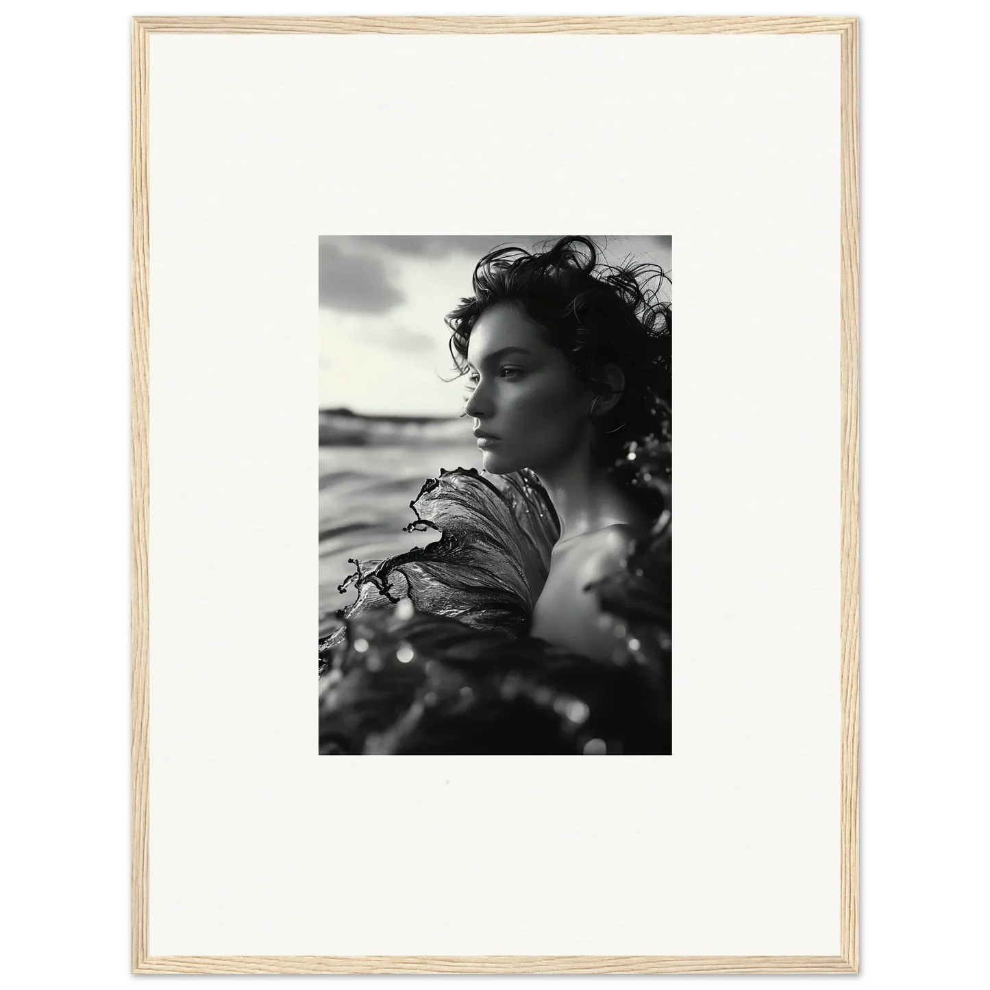 Black and white photo of a woman by water, perfect for sea reverie canvas print room decoration