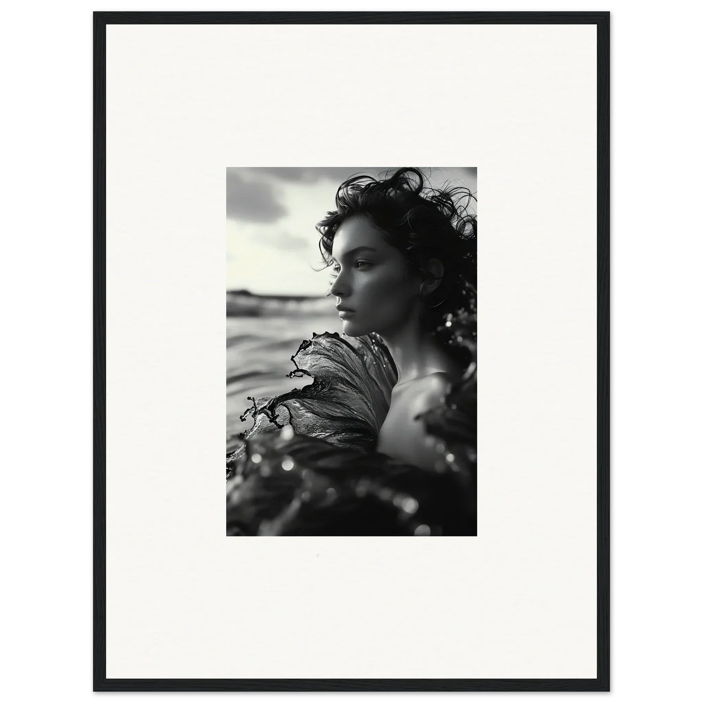 Black and white portrait of a woman with windswept hair for sea reverie canvas print