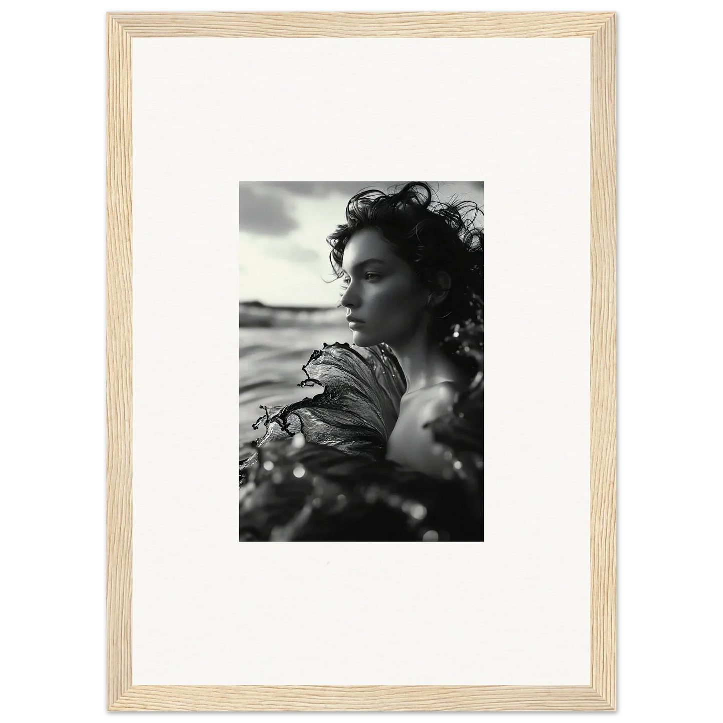 Black and white canvas print of a woman in sea reverie with windswept hair