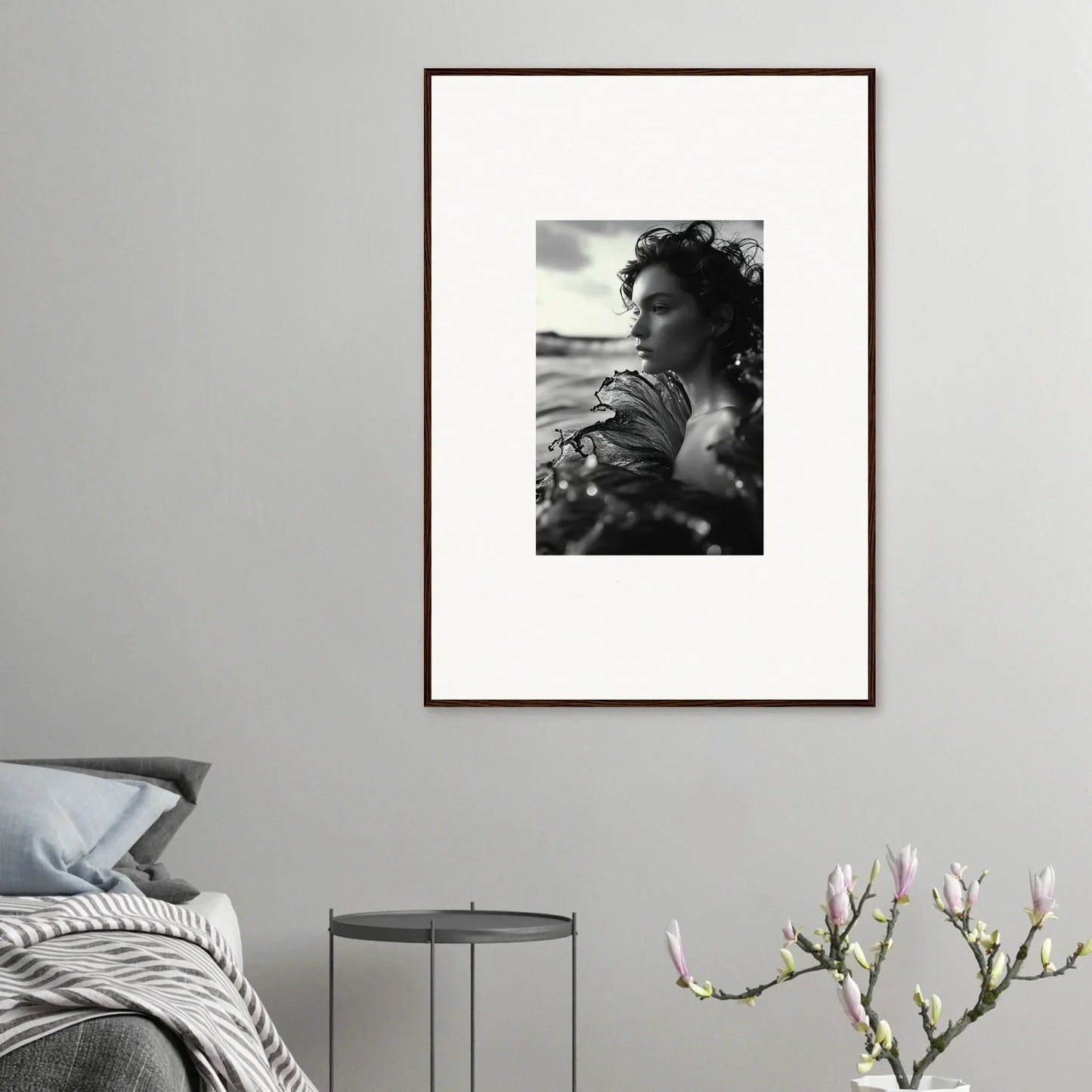 Framed black and white canvas print of a person for stylish sea reverie room decoration