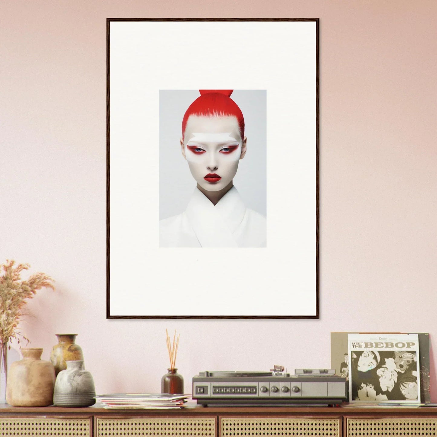 Framed wall art of a person with bright red hair and white makeup for stylish room decor