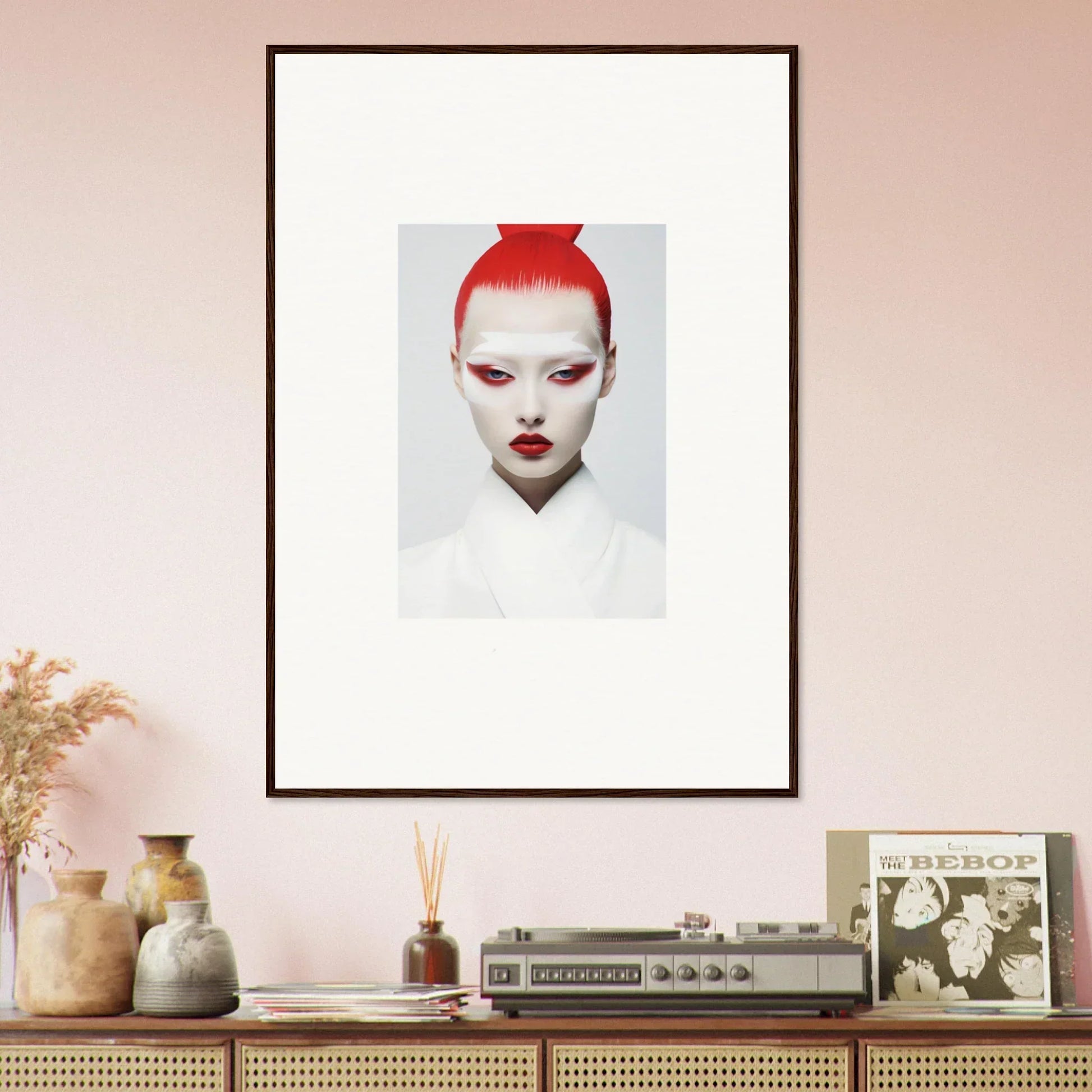 Framed wall art of a person with bright red hair and white makeup for stylish room decor
