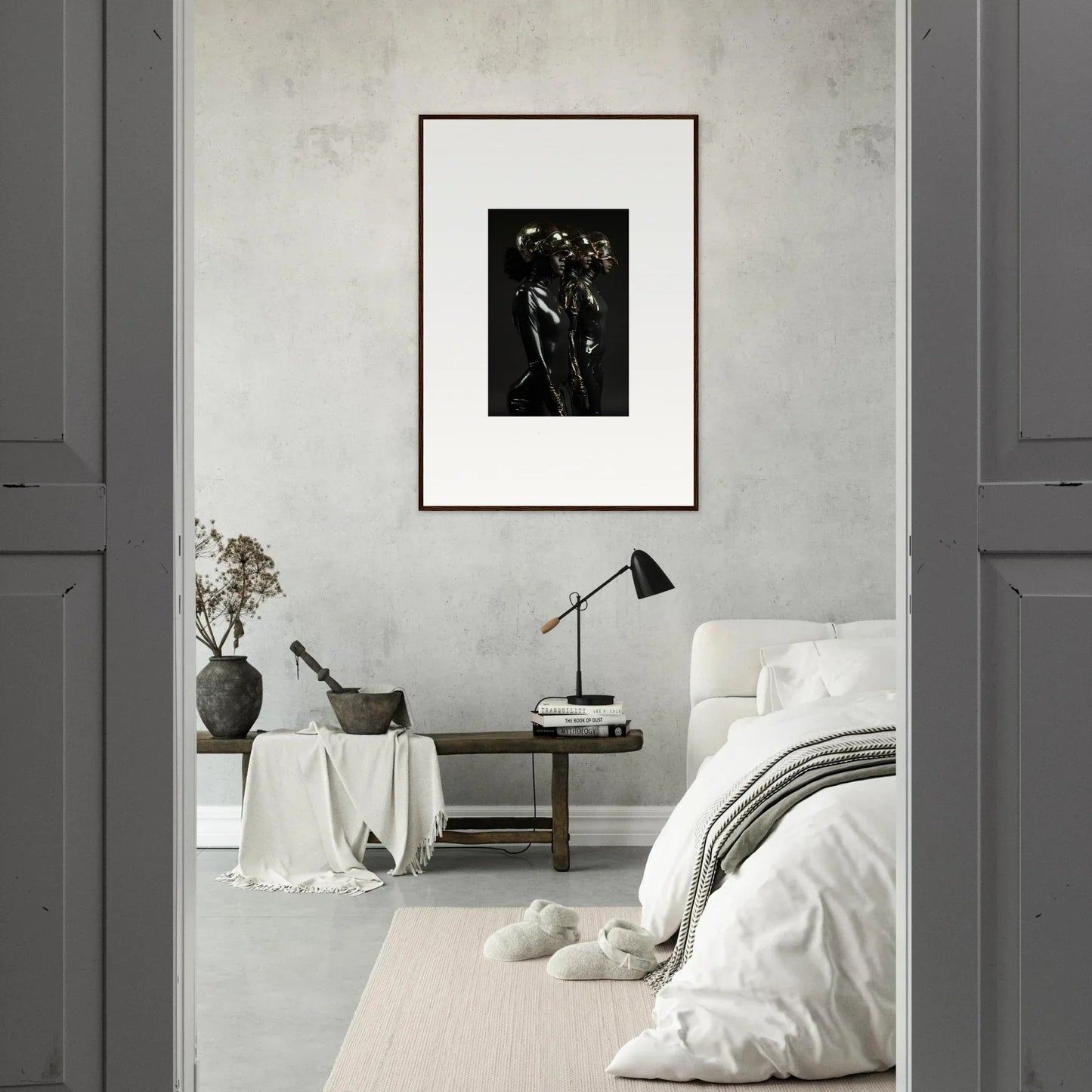 Minimalist bedroom with a framed black and white photograph as the focal point.