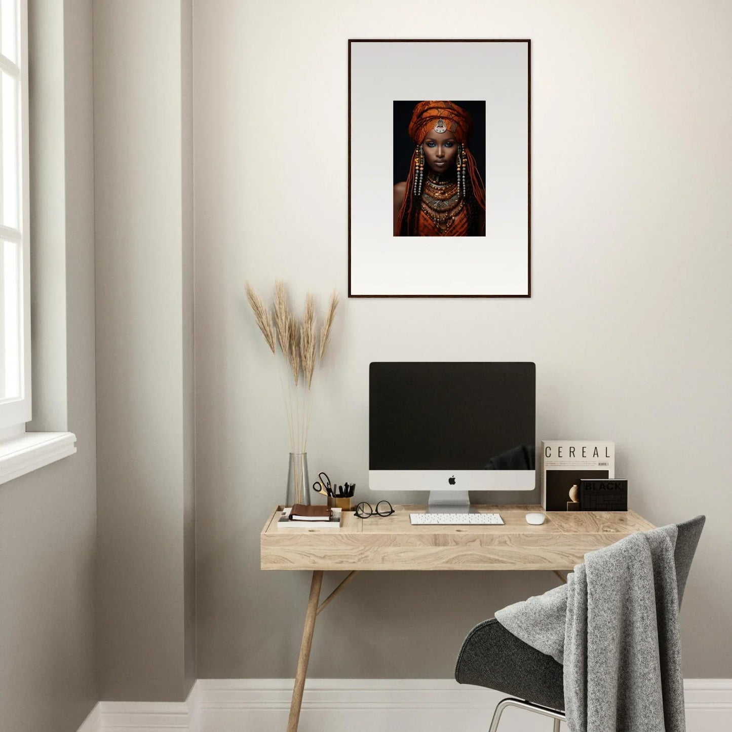 Minimalist wooden desk with iMac and framed artwork of Obsidian Ethereal Goddess