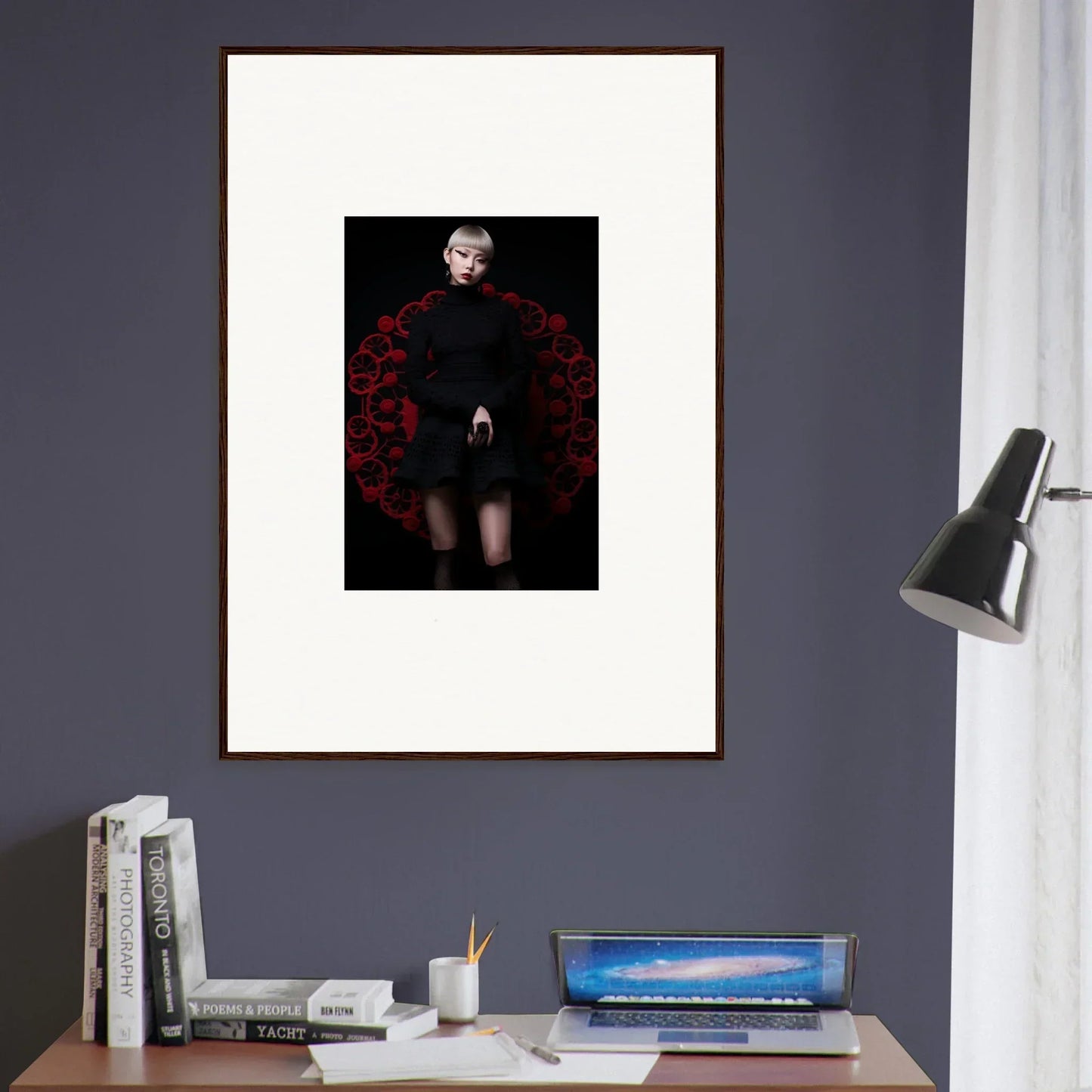 Framed portrait of Obsidian Lace Waltz with dark outfit and vibrant red roses