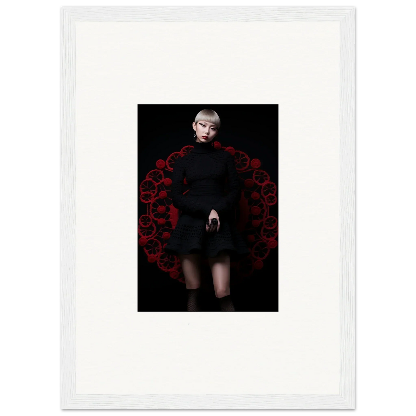 Figure in a black Obsidian Lace Waltz dress amid red roses circular pattern