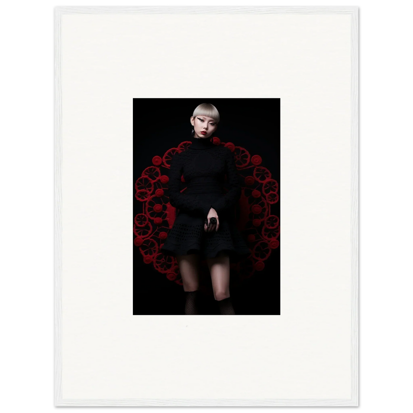 A figure in a black dress poses by a decorative red arch for Obsidian Lace Waltz