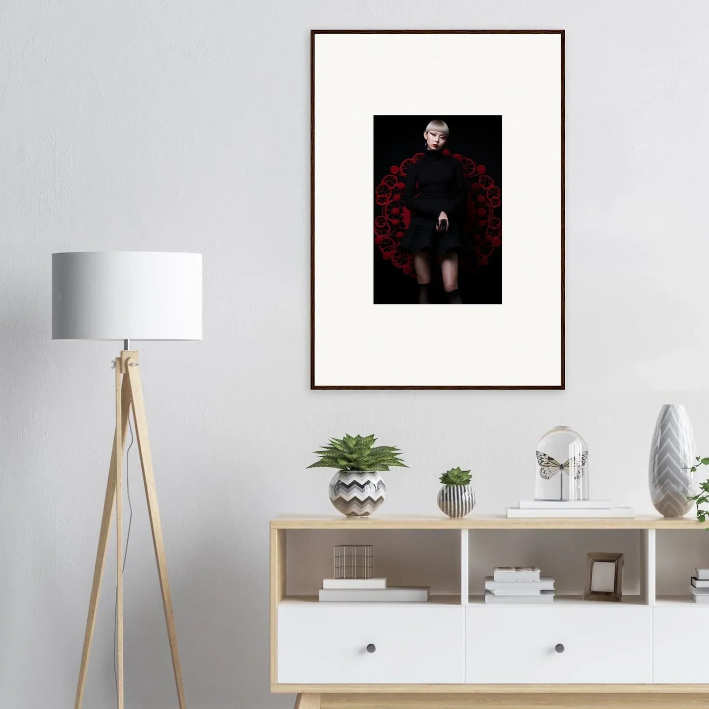 Framed dark fashion shot of Obsidian Lace Waltz with a figure in red feathered collar