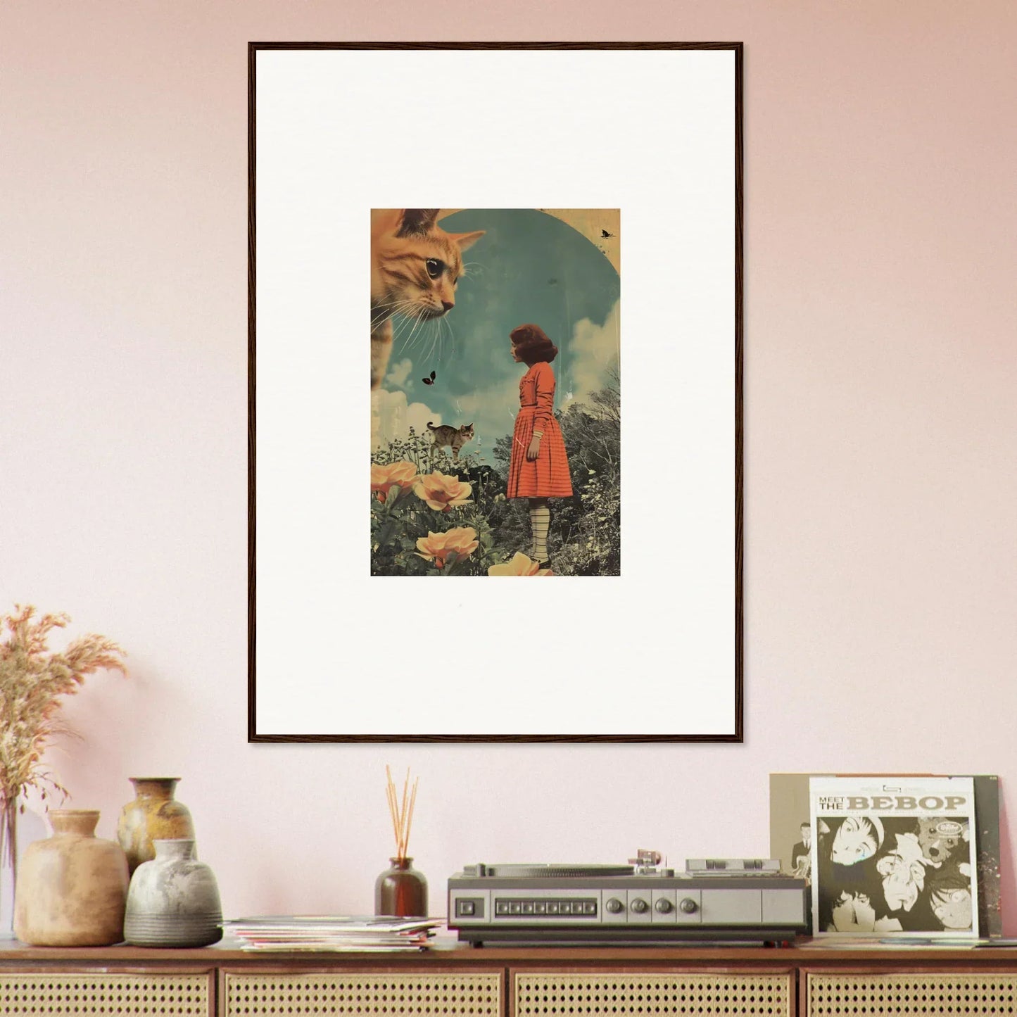 Framed surrealist wall art featuring a person in a red dress and a giant cat head