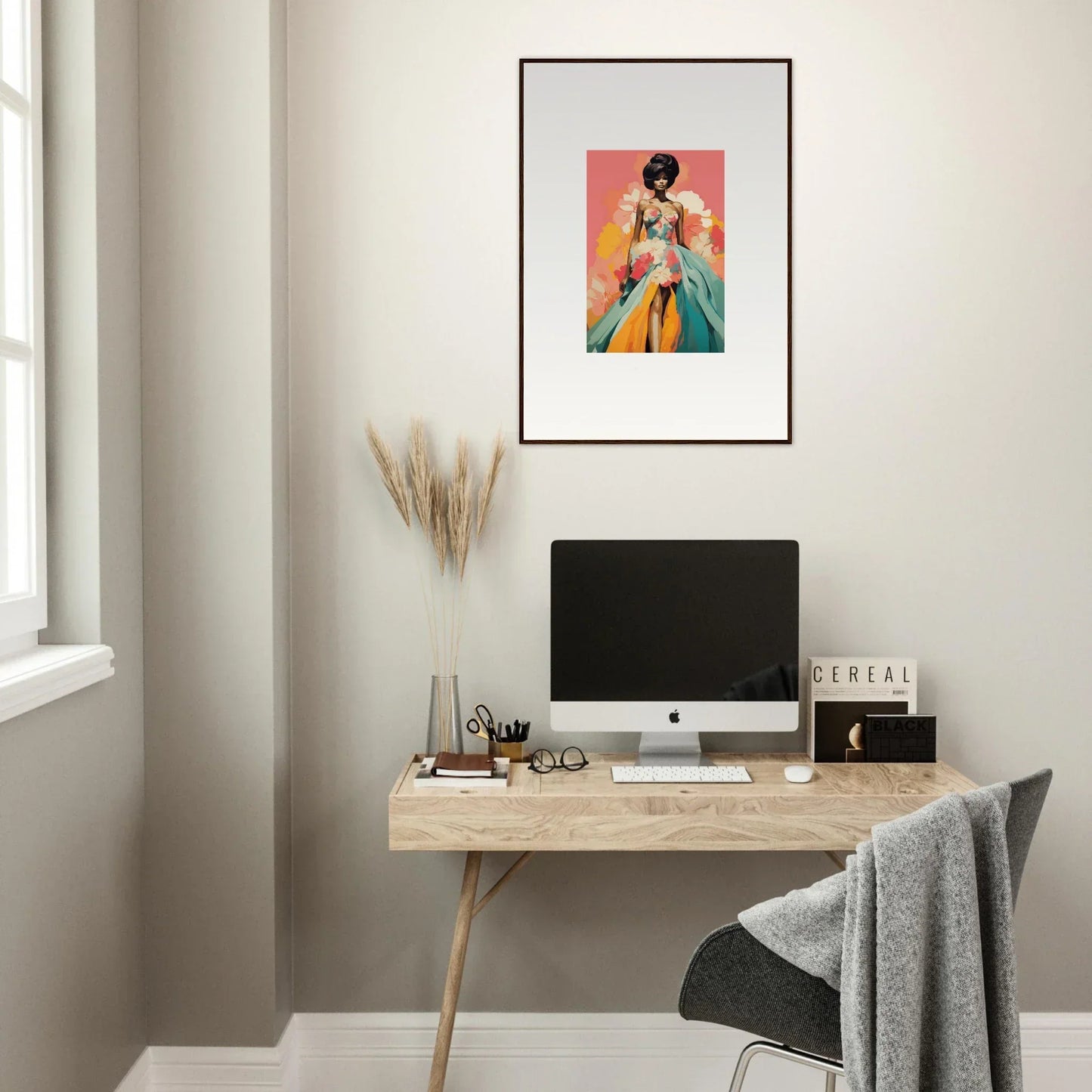 Minimalist wooden desk with iMac and Petal Encounters Masquerade framed wall art