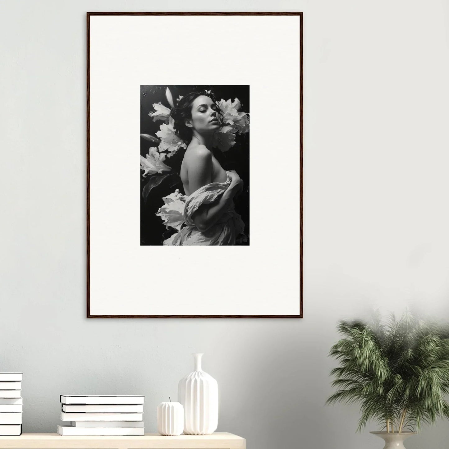 Framed black and white photo of a woman with flowers, perfect for room decoration