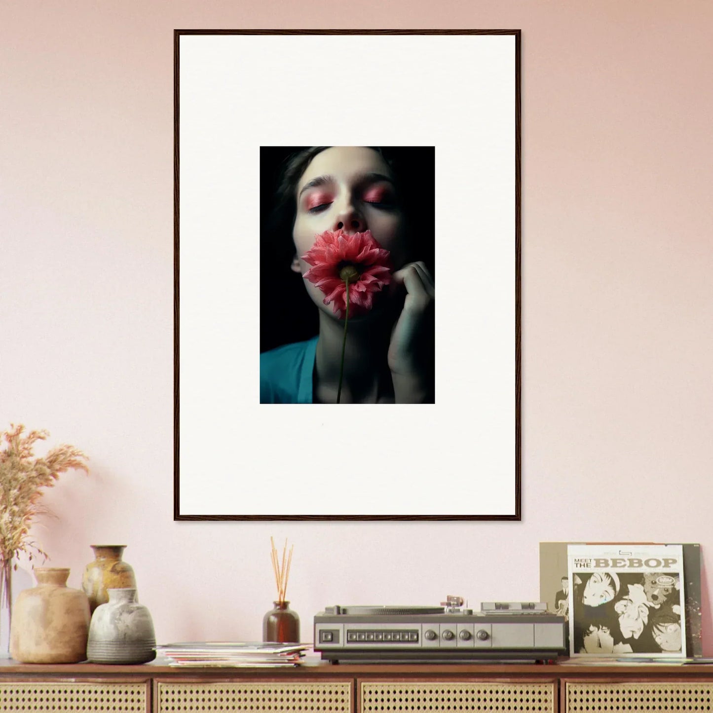 Framed wall art of a person with a red flower, perfect for room decoration