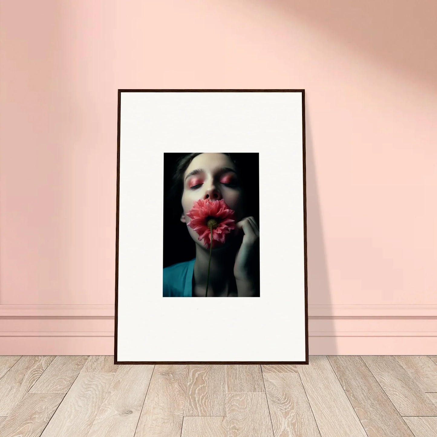 Framed wall art of a person holding a red flower, perfect for room decoration