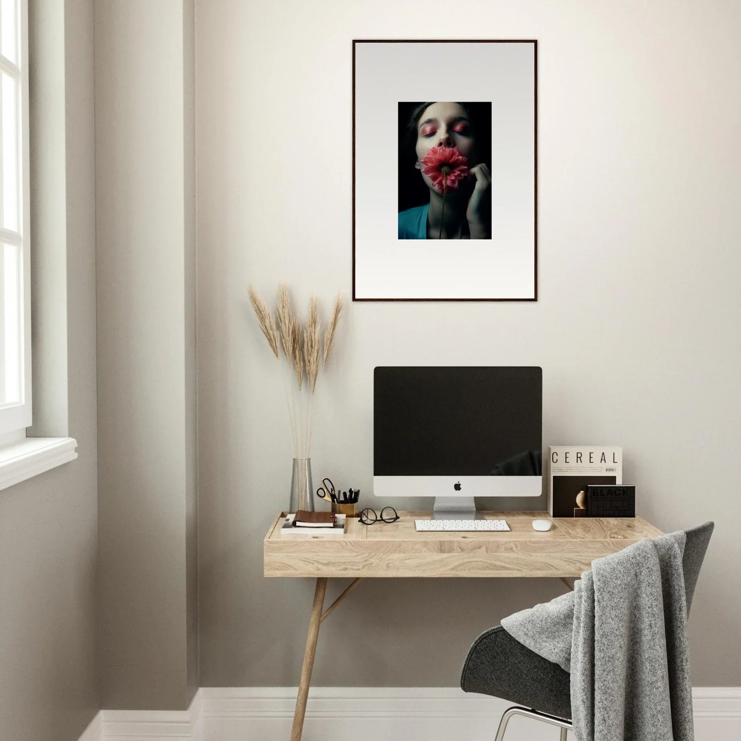 Framed wall art of a person with a red flower for unique room decoration